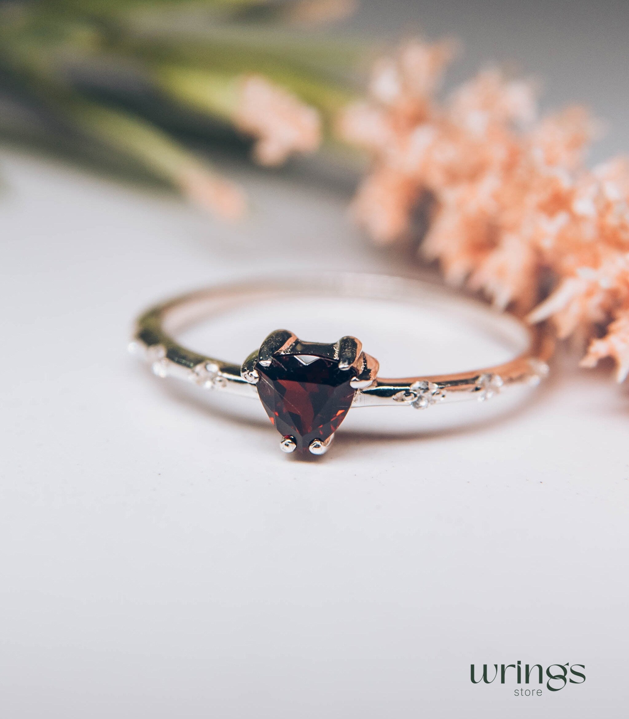 Central Trillion Garnet Side Stone Engagement Ring Silver