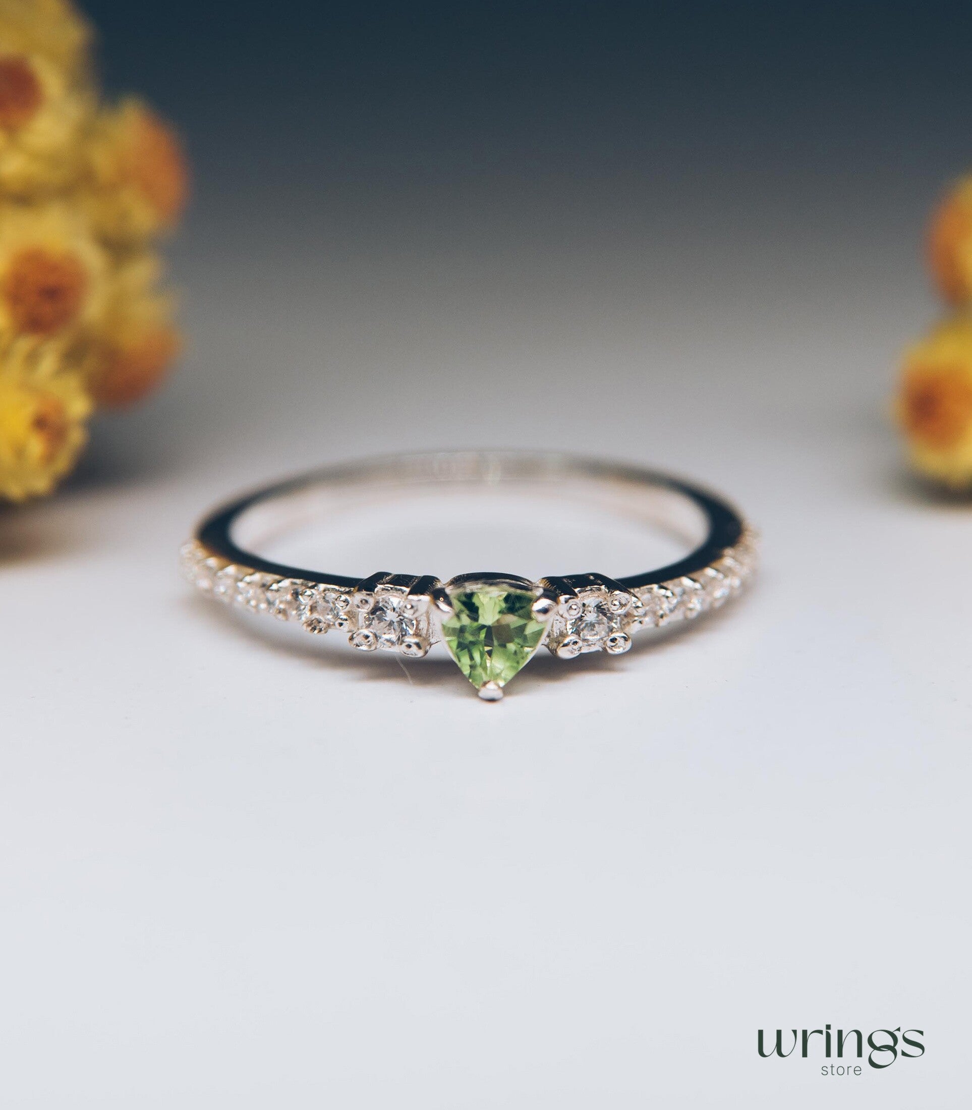 Small Central Peridot Three Stone Engagement Ring