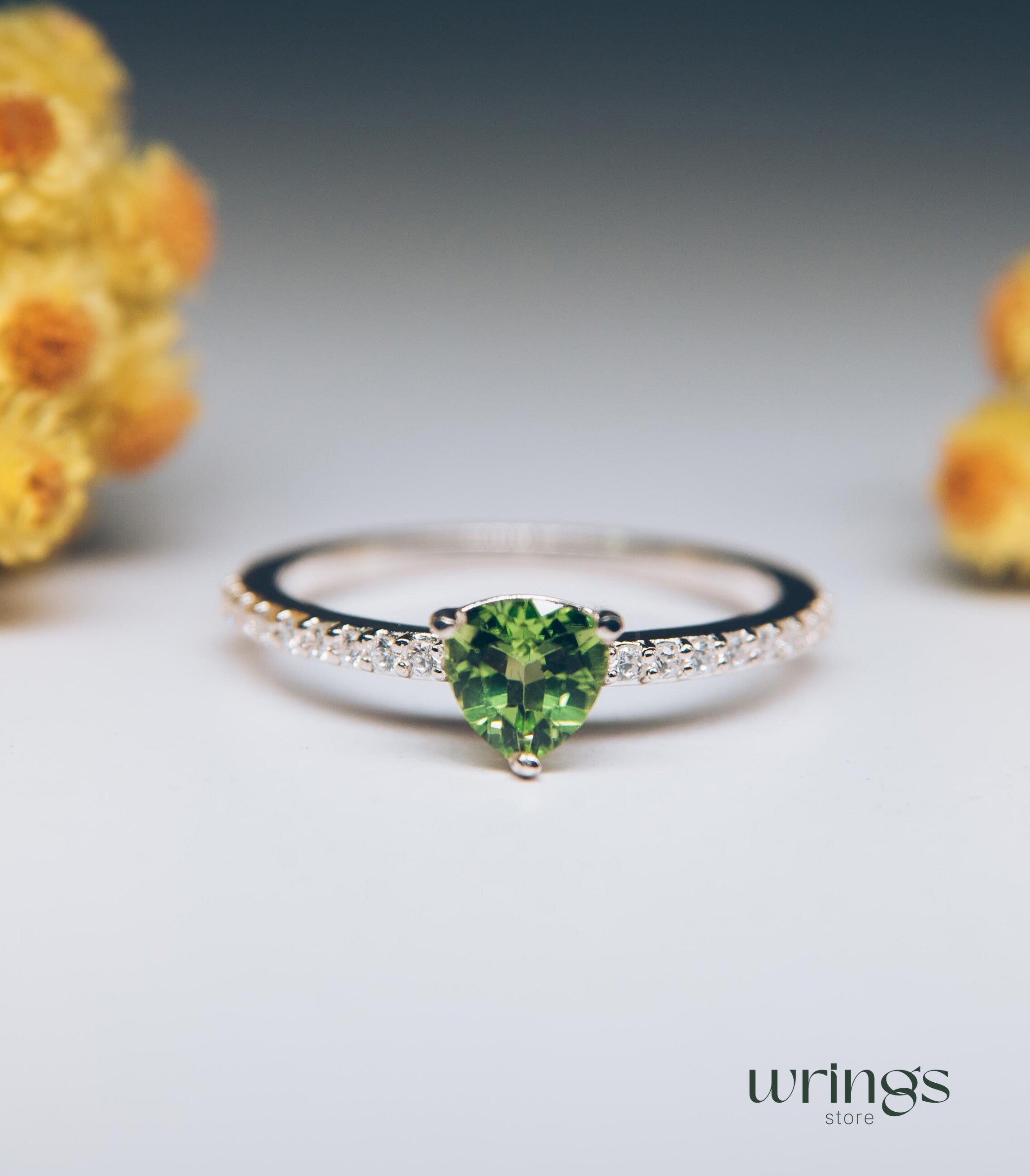 Trilliant Peridot Engagement Ring & CZ Side Stones