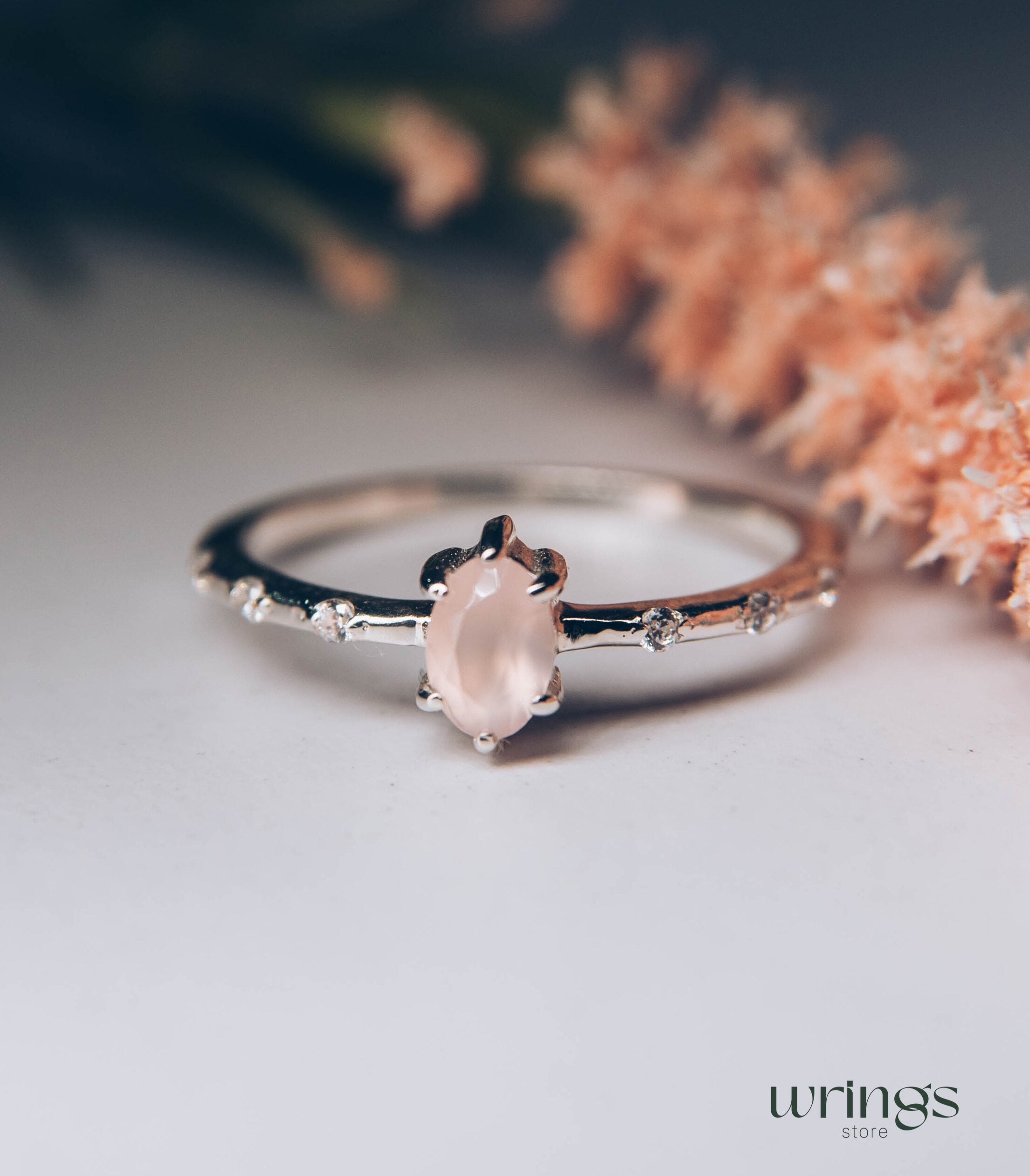 Central Oval Rose Quartz Side Stone Engagement Ring Silver