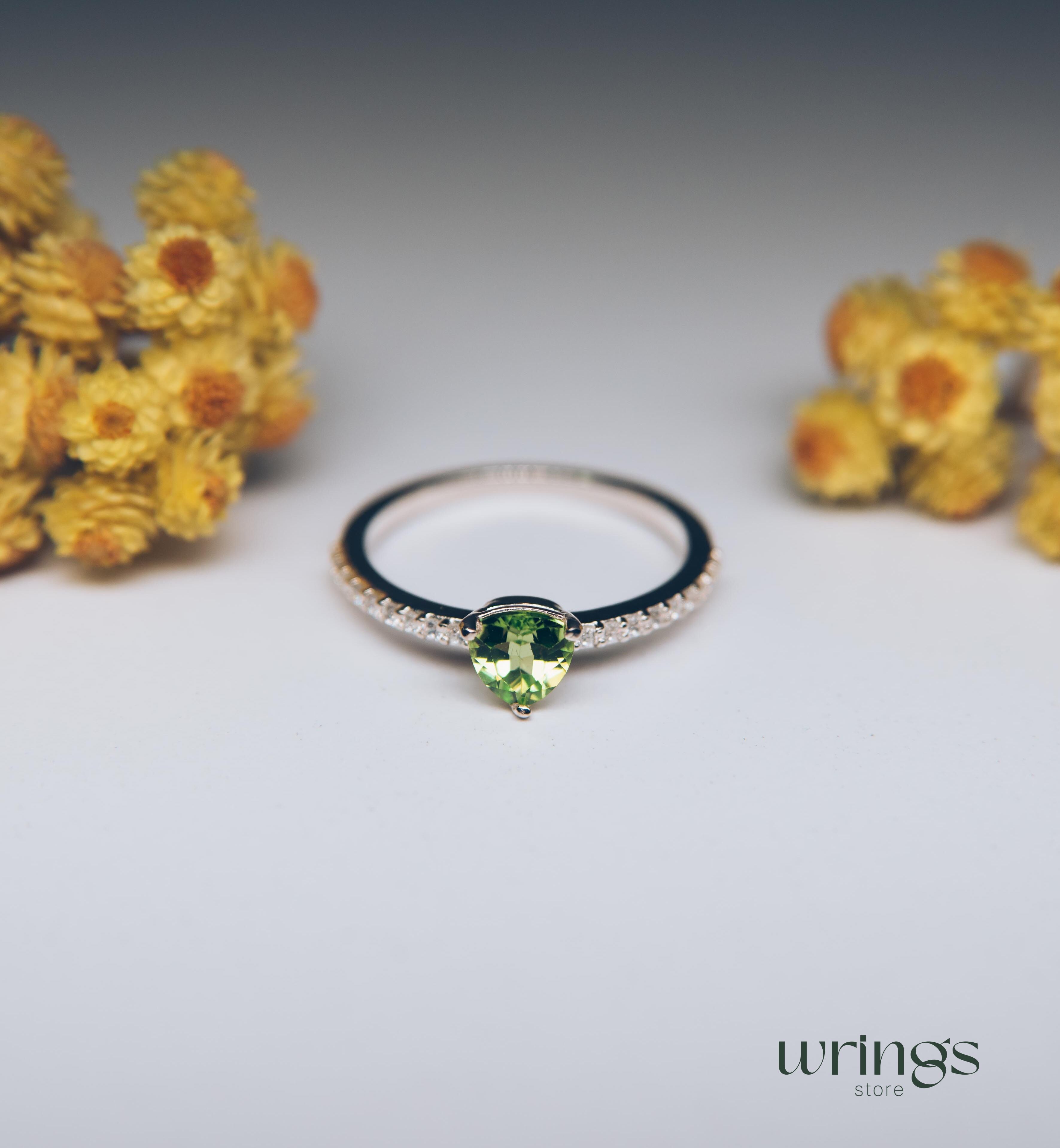 Trilliant Peridot Engagement Ring & CZ Side Stones