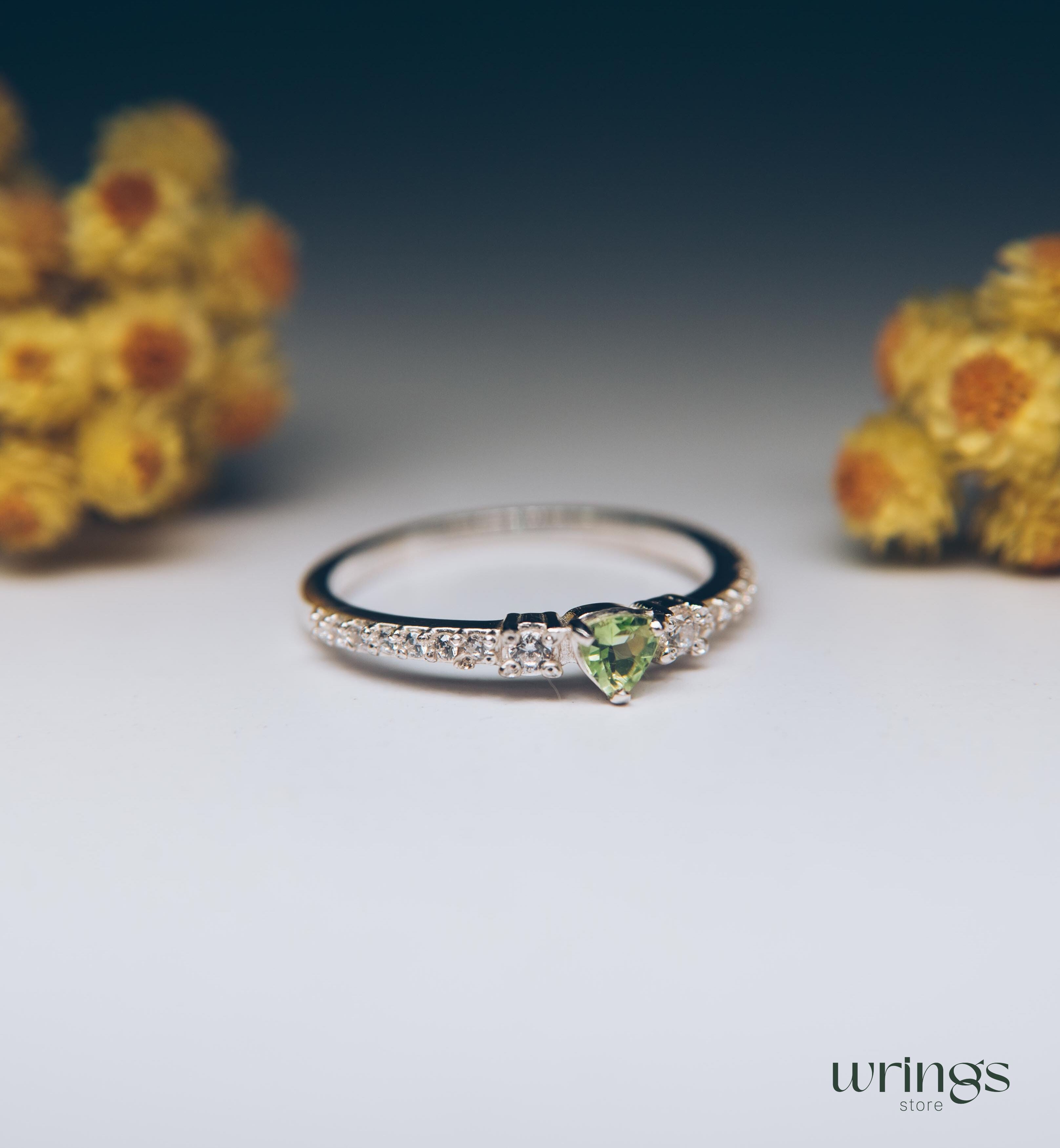 Small Central Peridot Three Stone Engagement Ring