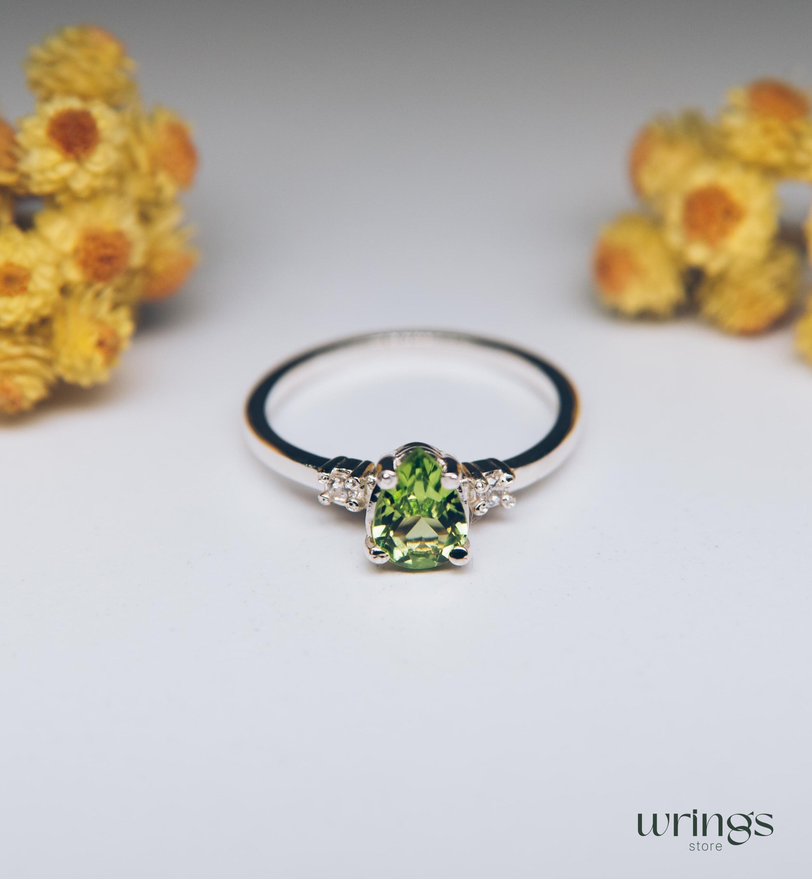 Large Pear Peridot Three Stone Engagement Ring Silver