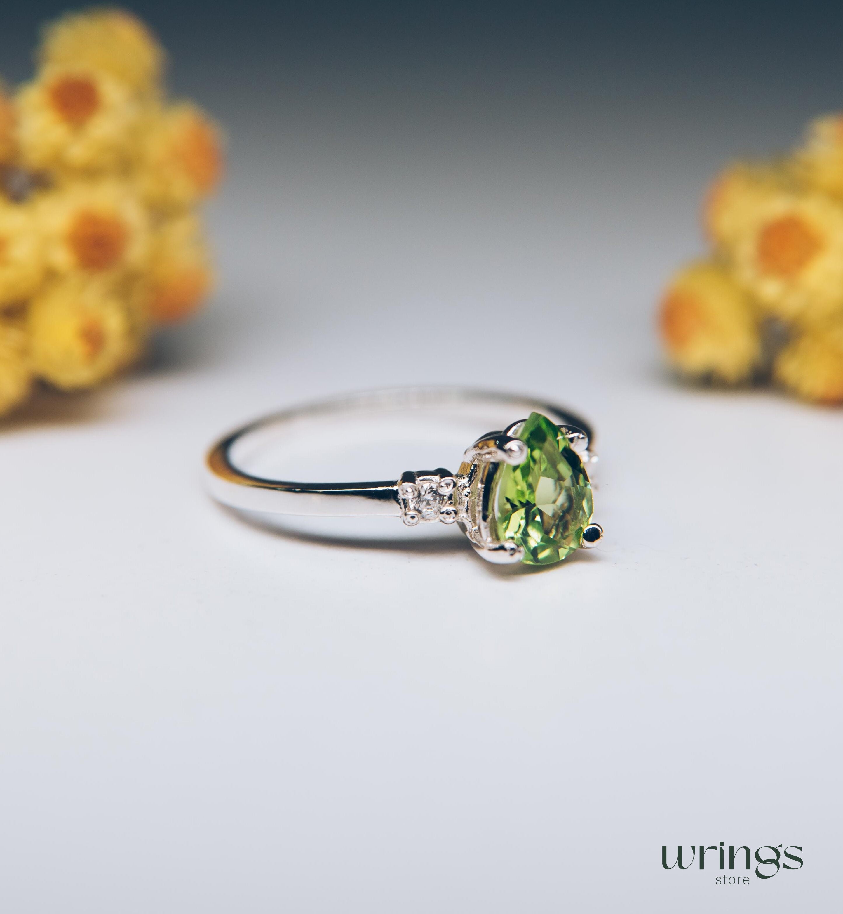 Large Pear Peridot Three Stone Engagement Ring Silver