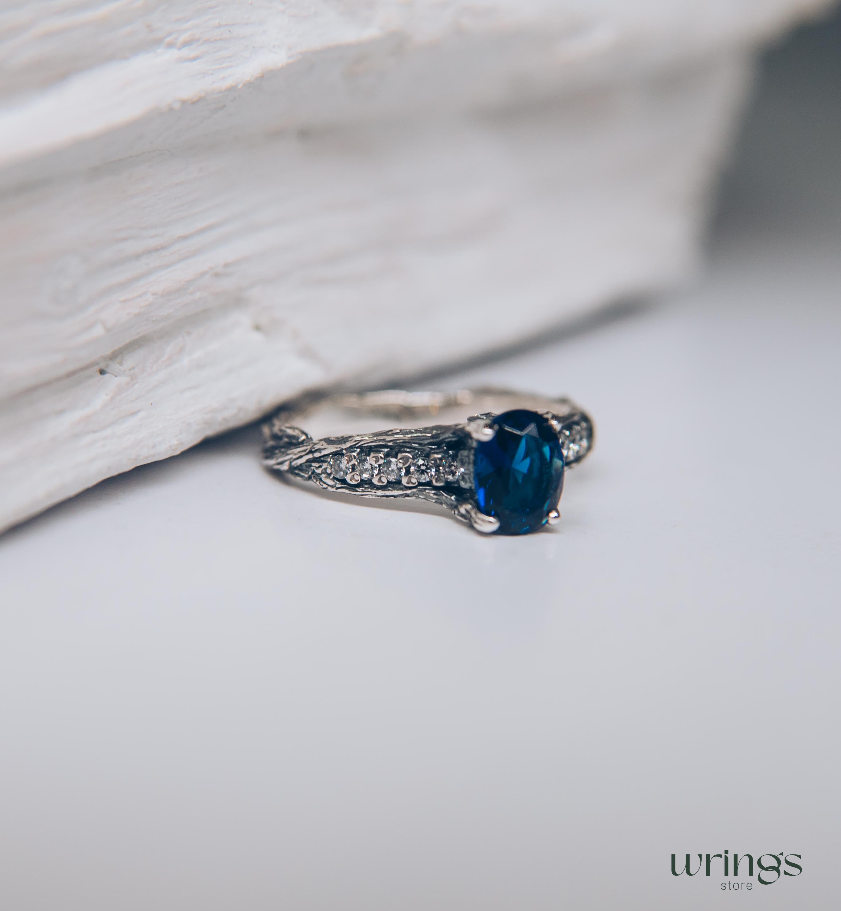 Dainty Oval Sapphire Ring – Side Stones on Silver Branch