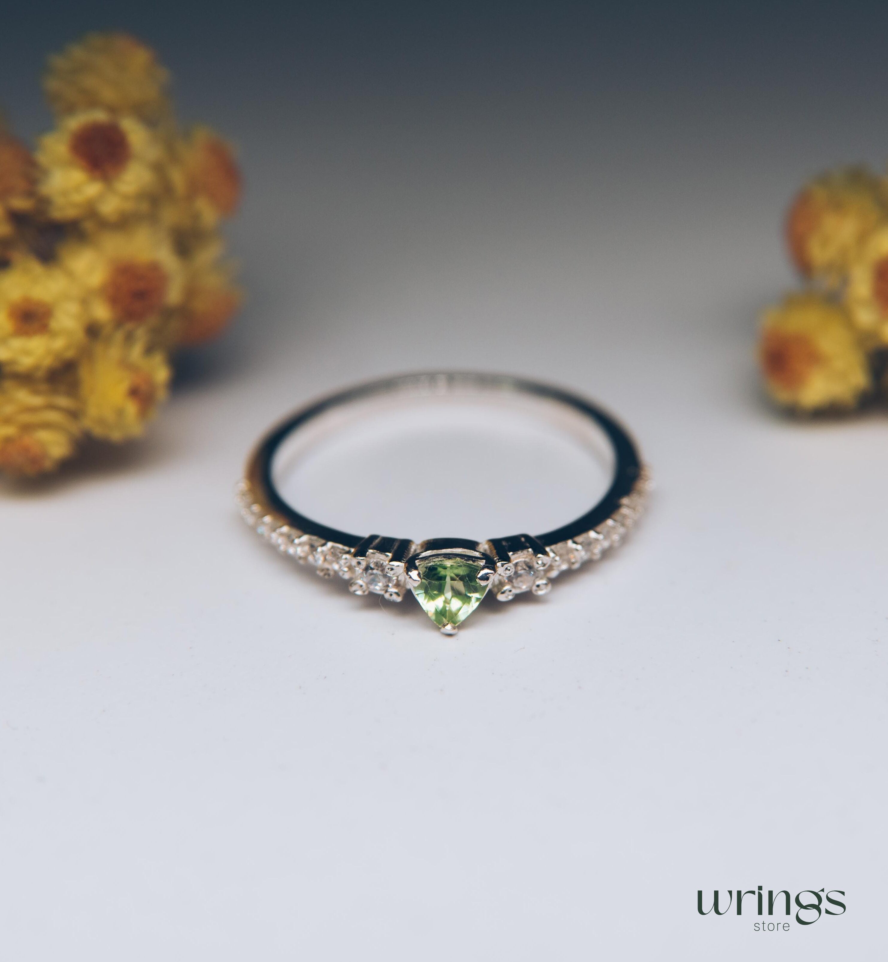 Small Central Peridot Three Stone Engagement Ring