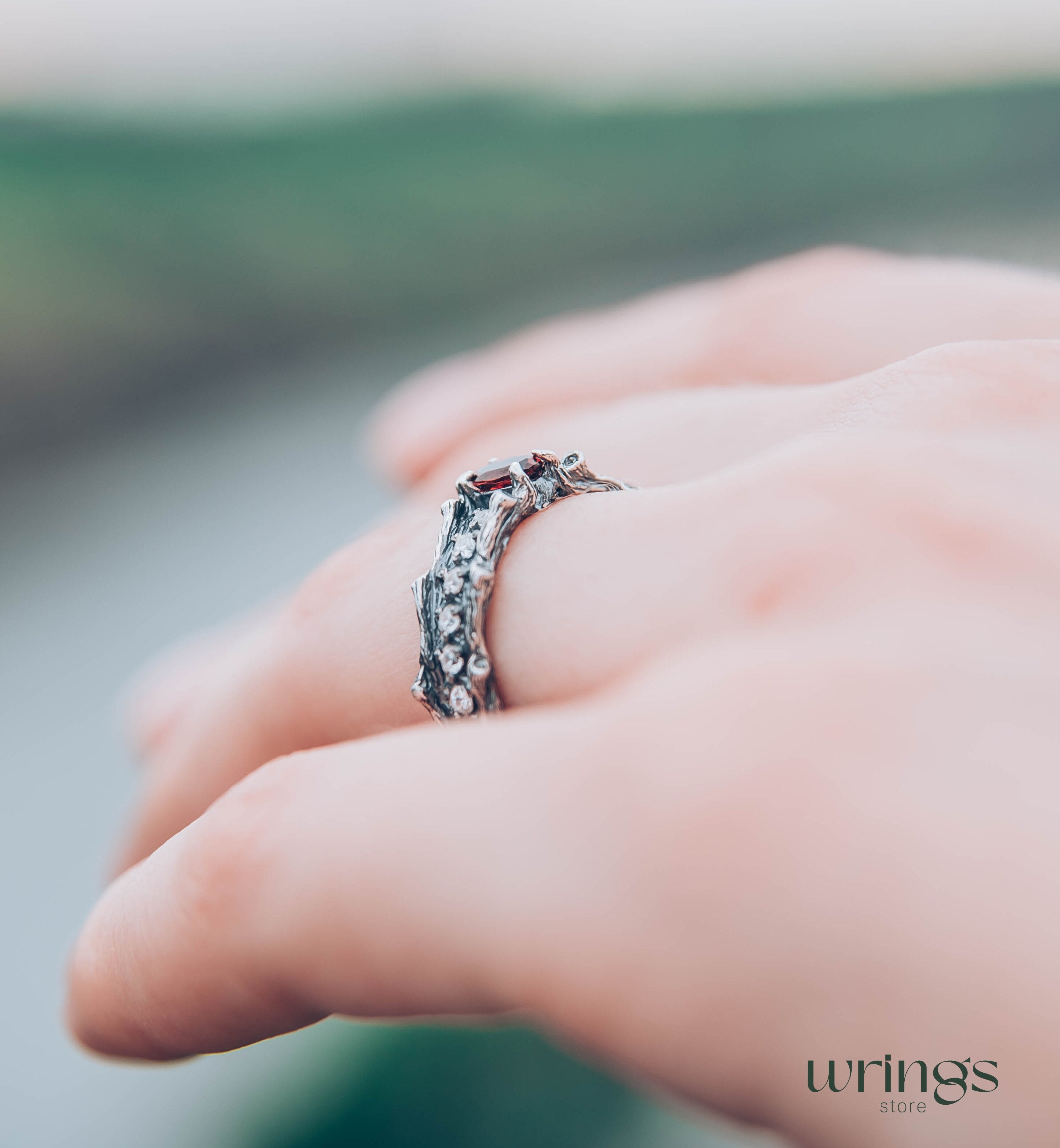 Knot and Branch Garnet Engagement Ring with Side Stones