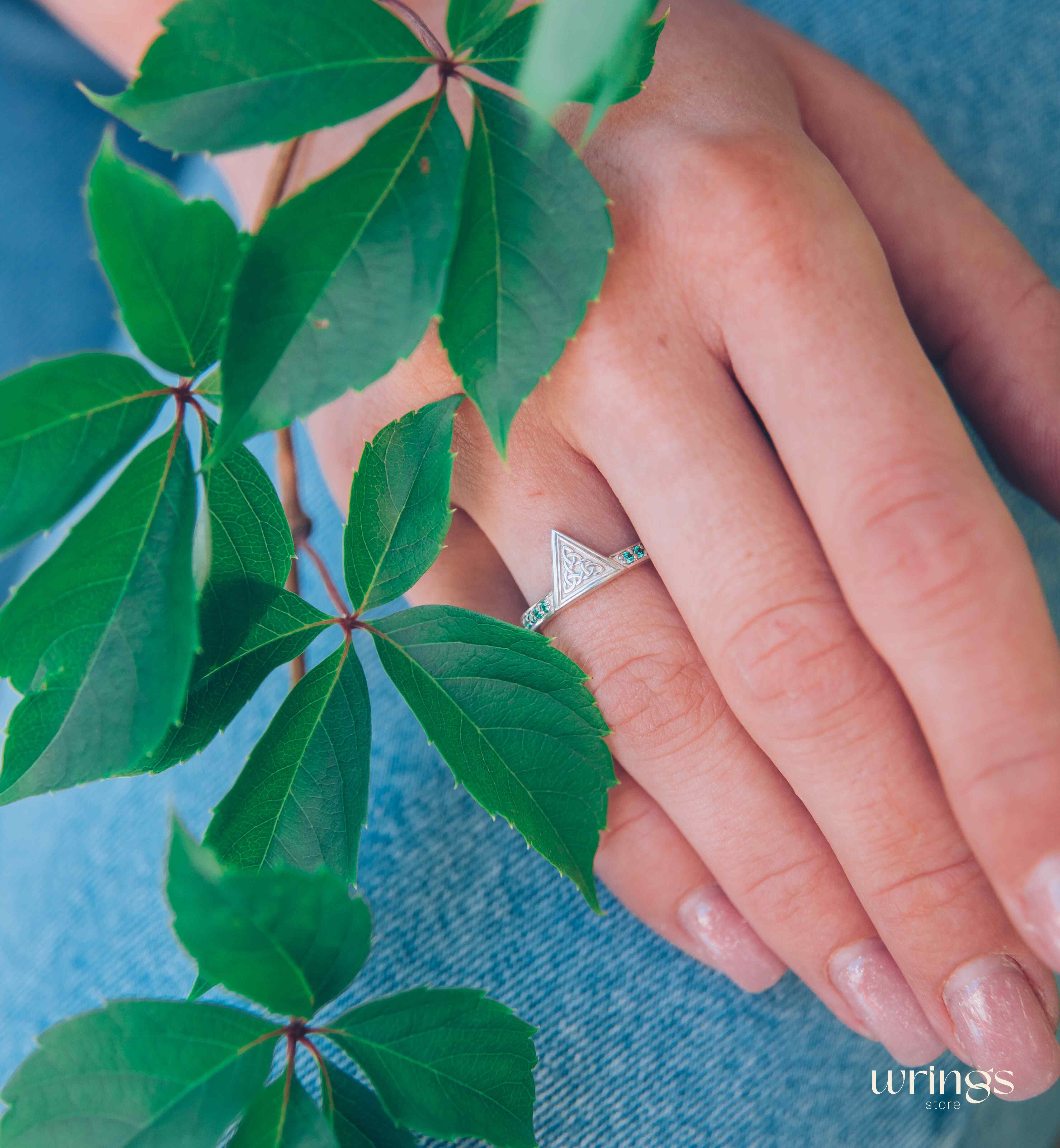 Engraved Celtic Trinity Triangle Ring with Side Emeralds