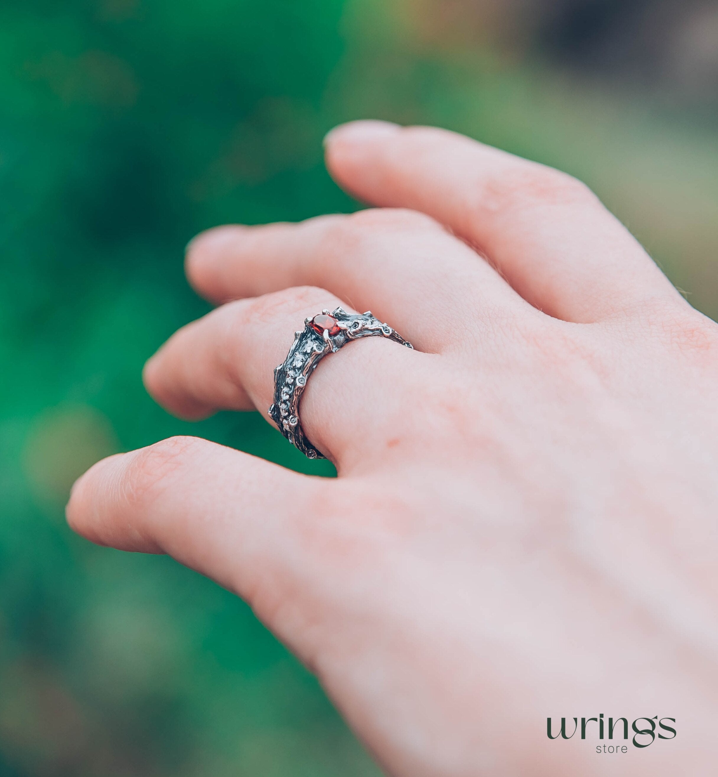 Knot and Branch Garnet Engagement Ring with Side Stones