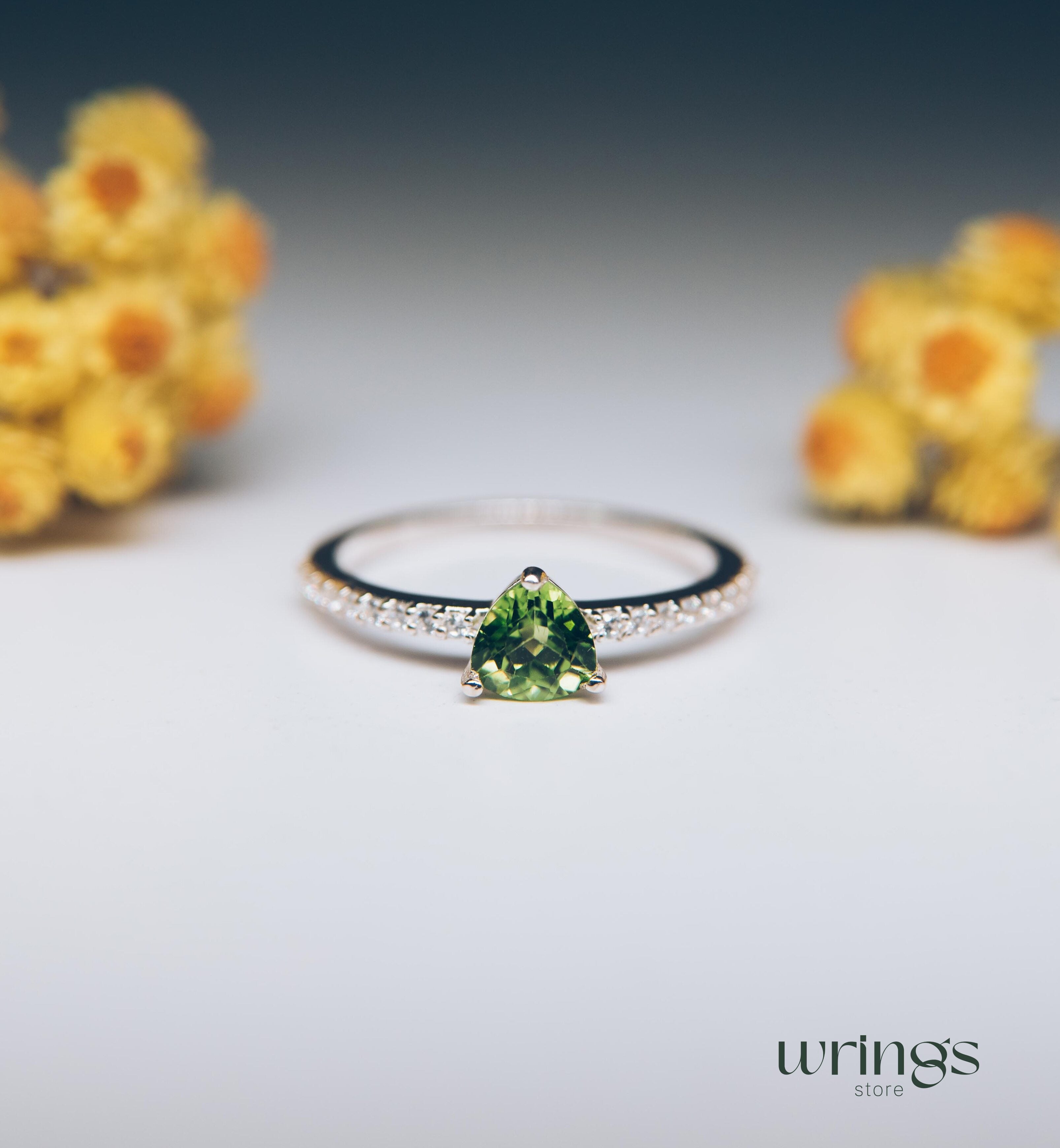 Trilliant Peridot Engagement Ring & CZ Side Stones