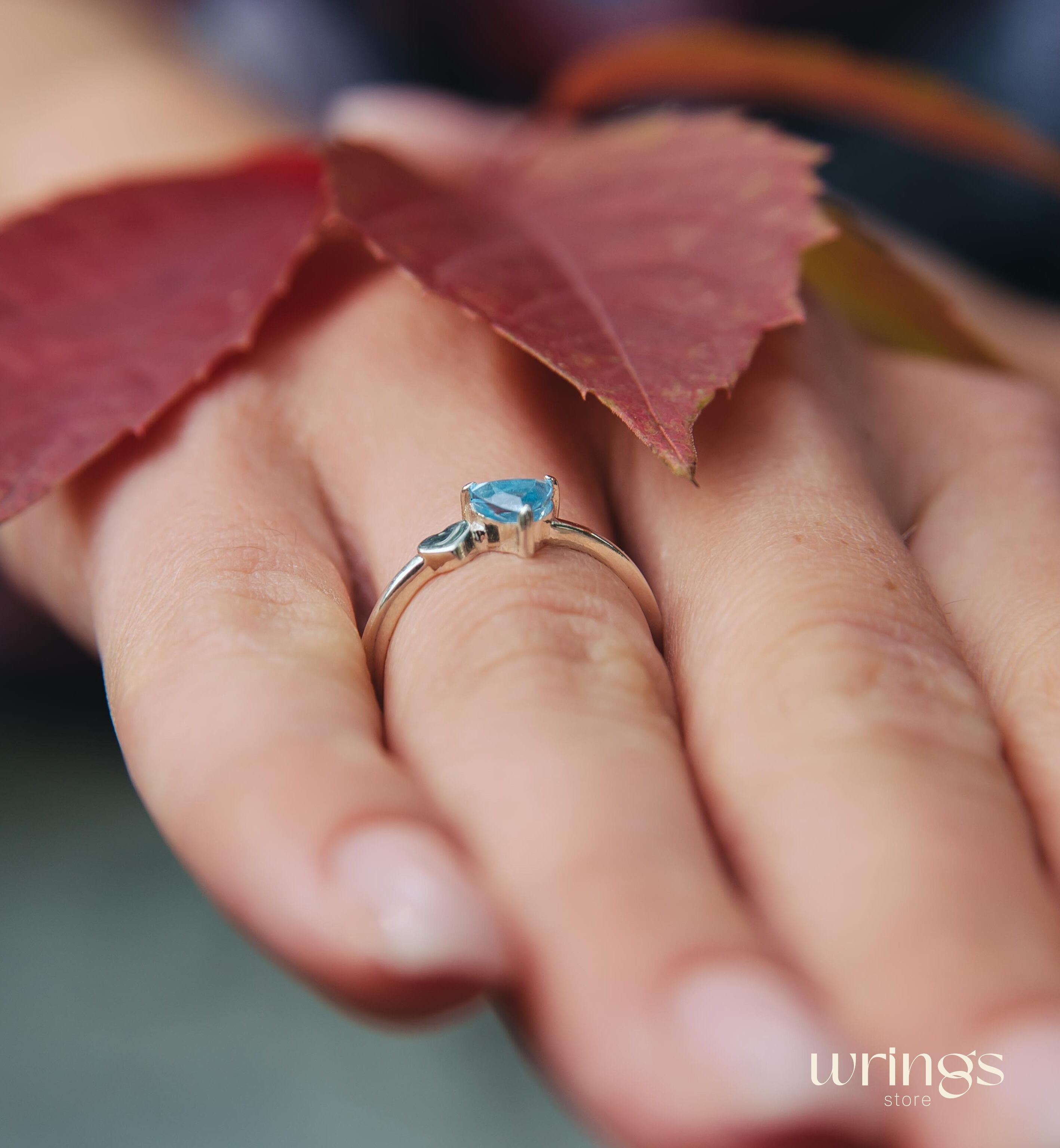 Trillion Swiss Blue Topaz Engagement Ring with Side Heart