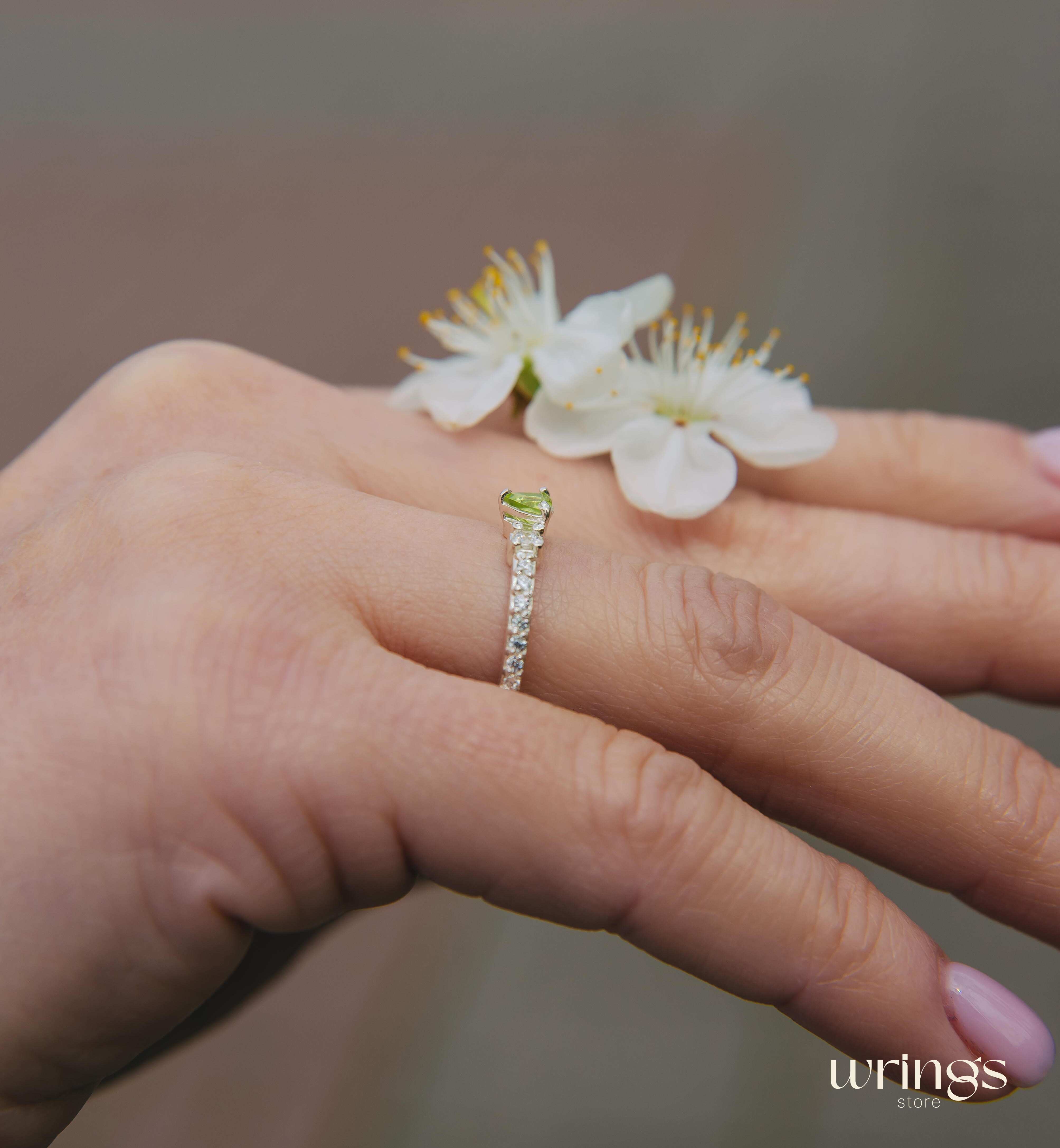 Small Central Peridot Three Stone Engagement Ring