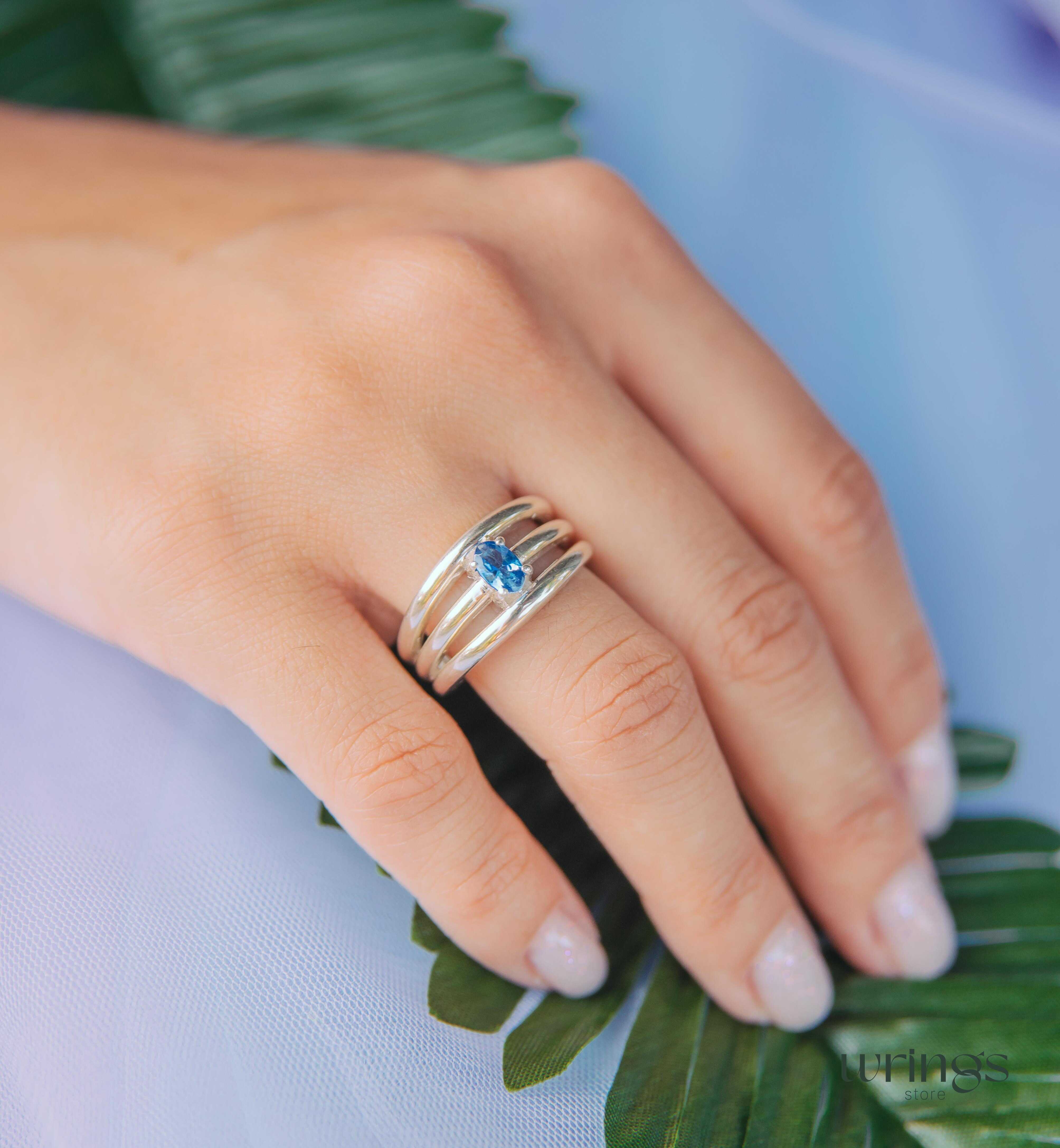 Oval Tanzanite Silver Triple Shank Engagement Ring