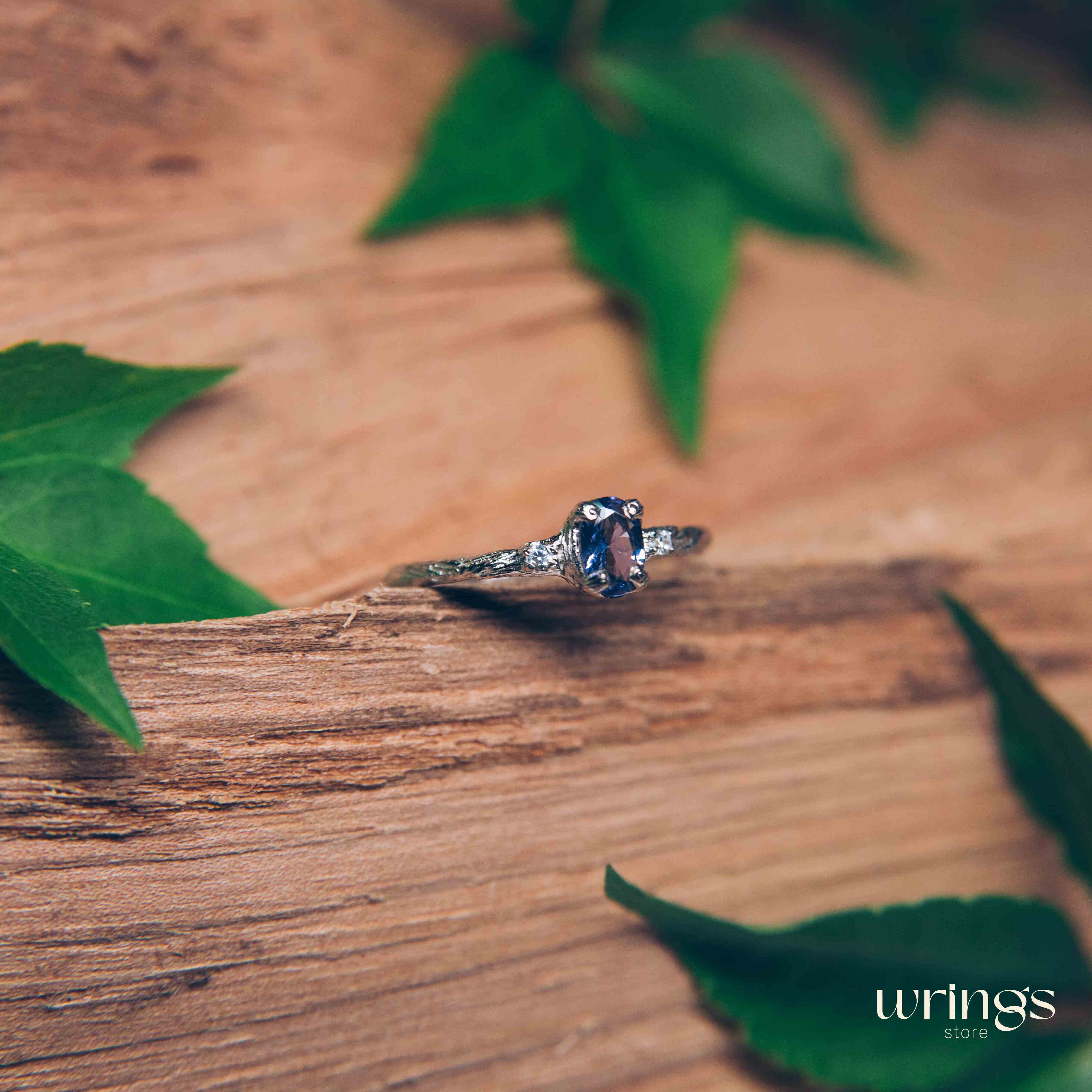 Tanzanite in Small Silver Twig Ring & CZ Side Stones