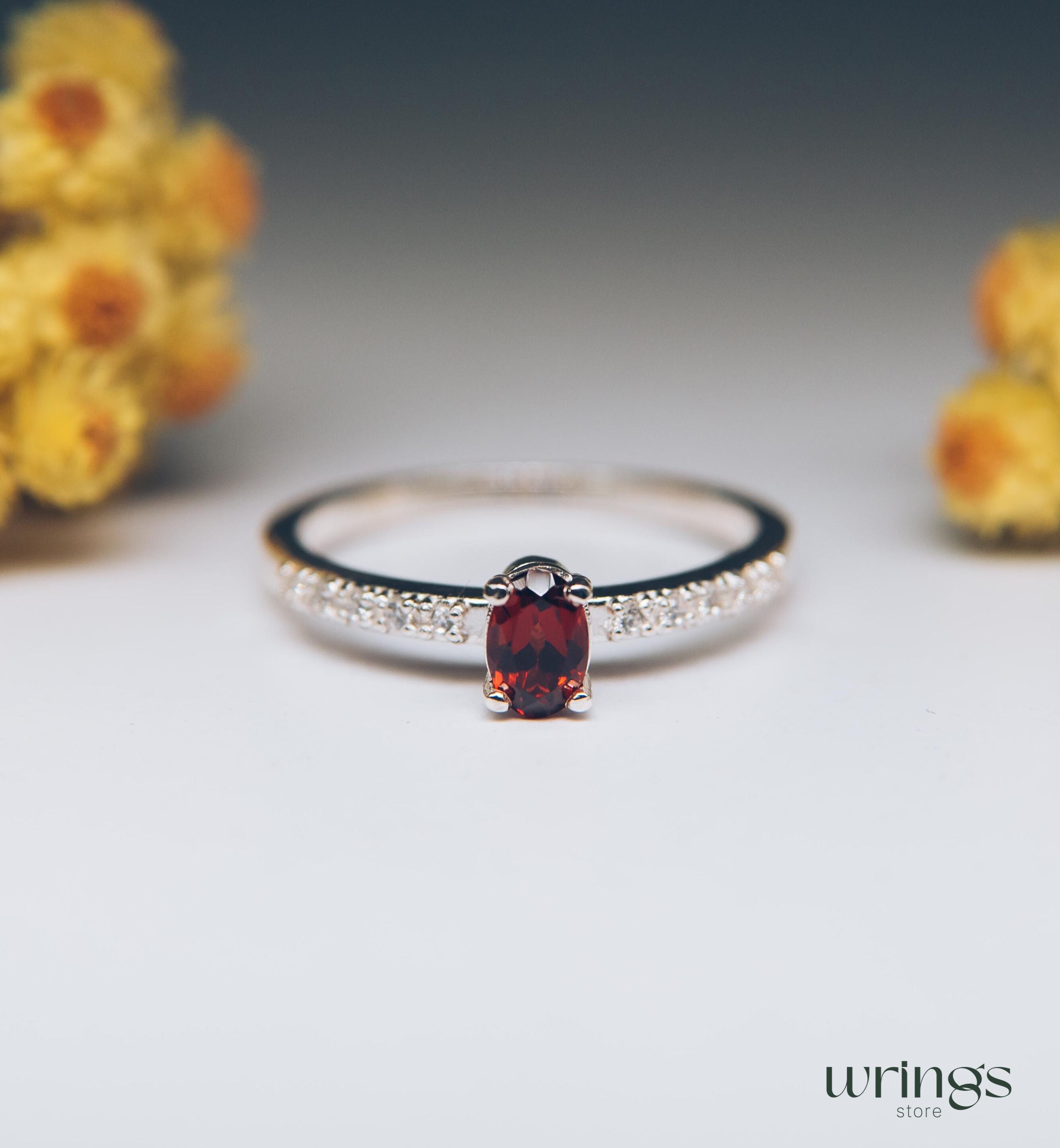 Red Oval Garnet Silver Ring with White Side Stones