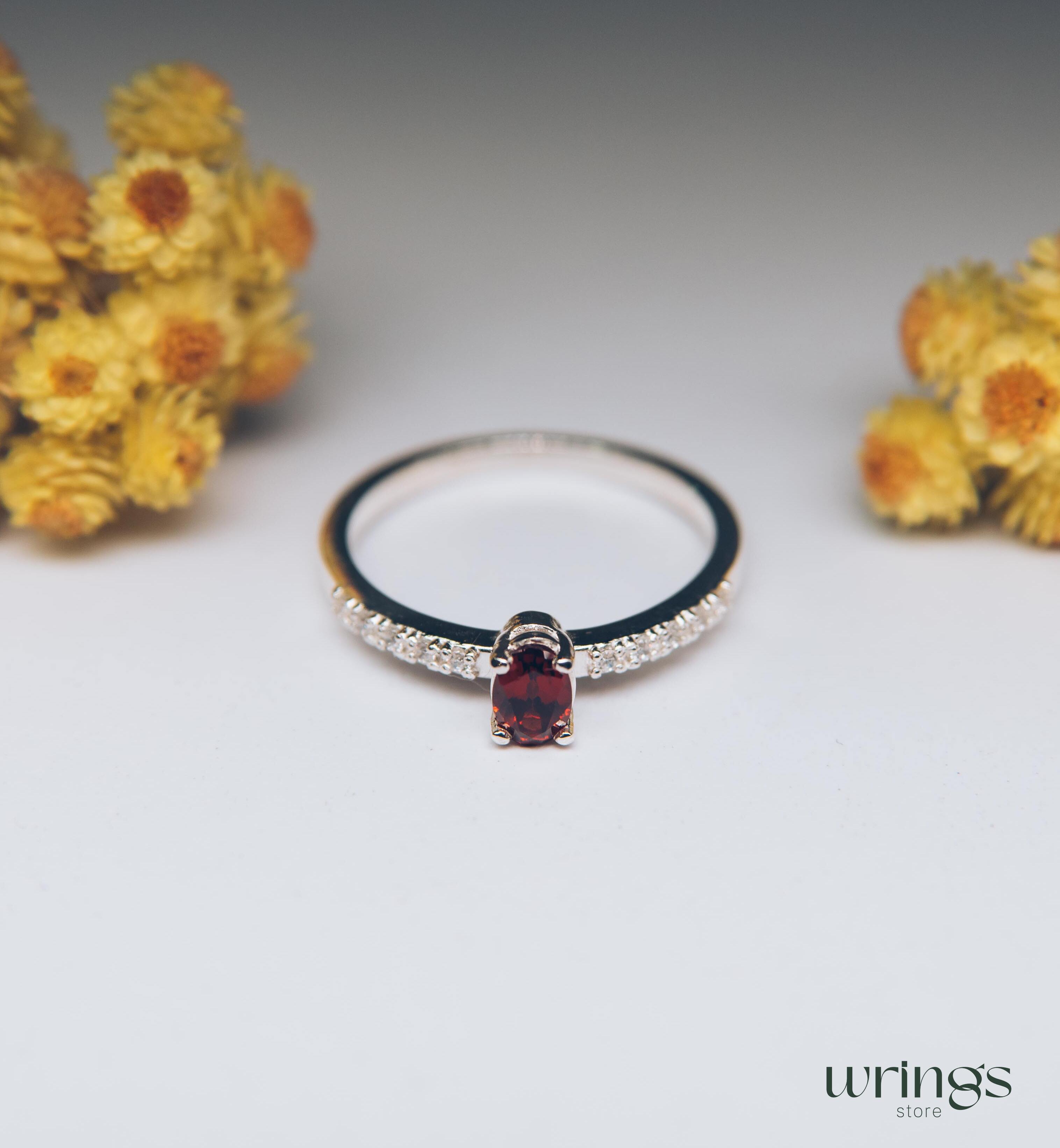 Red Oval Garnet Silver Ring with White Side Stones