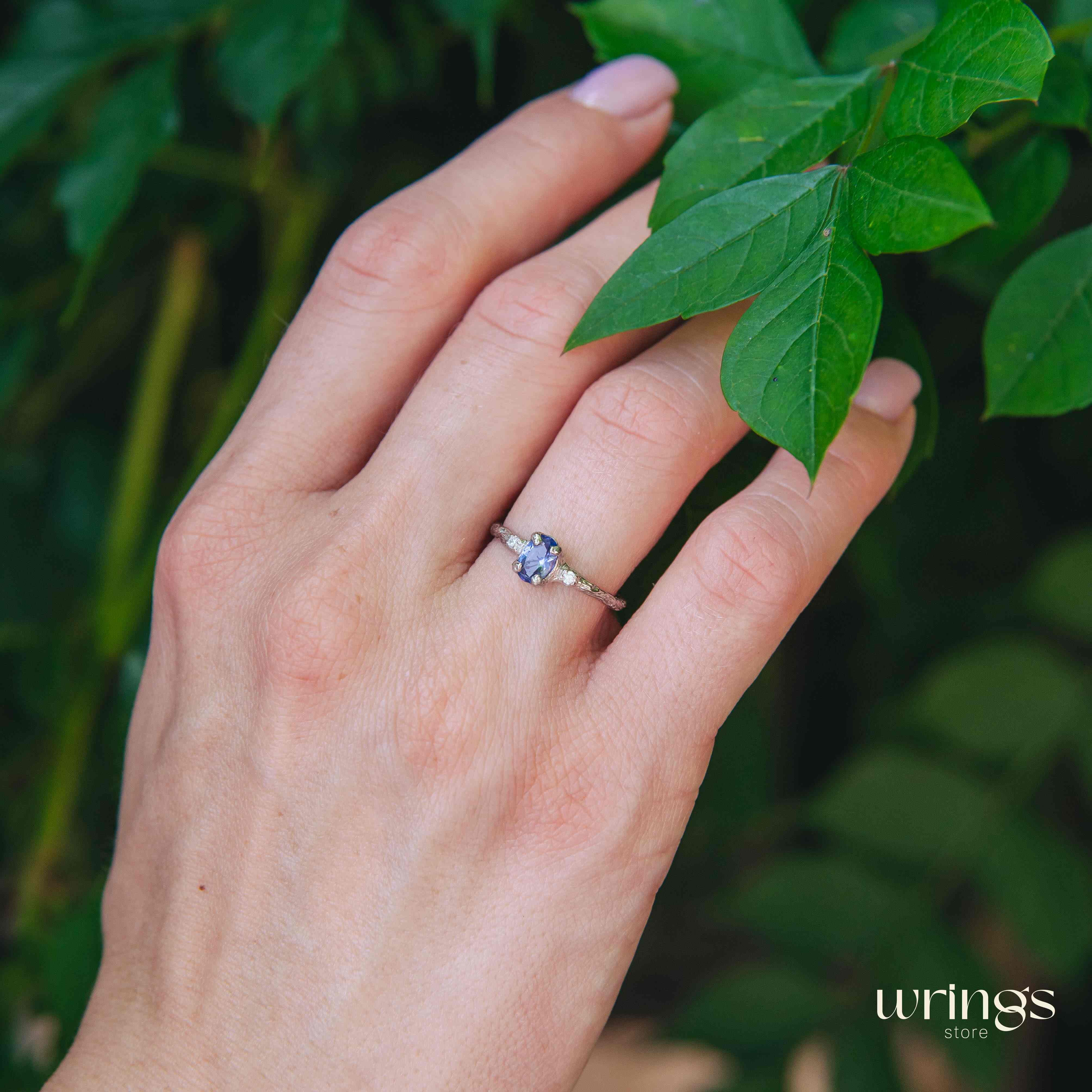 Tanzanite in Small Silver Twig Ring & CZ Side Stones