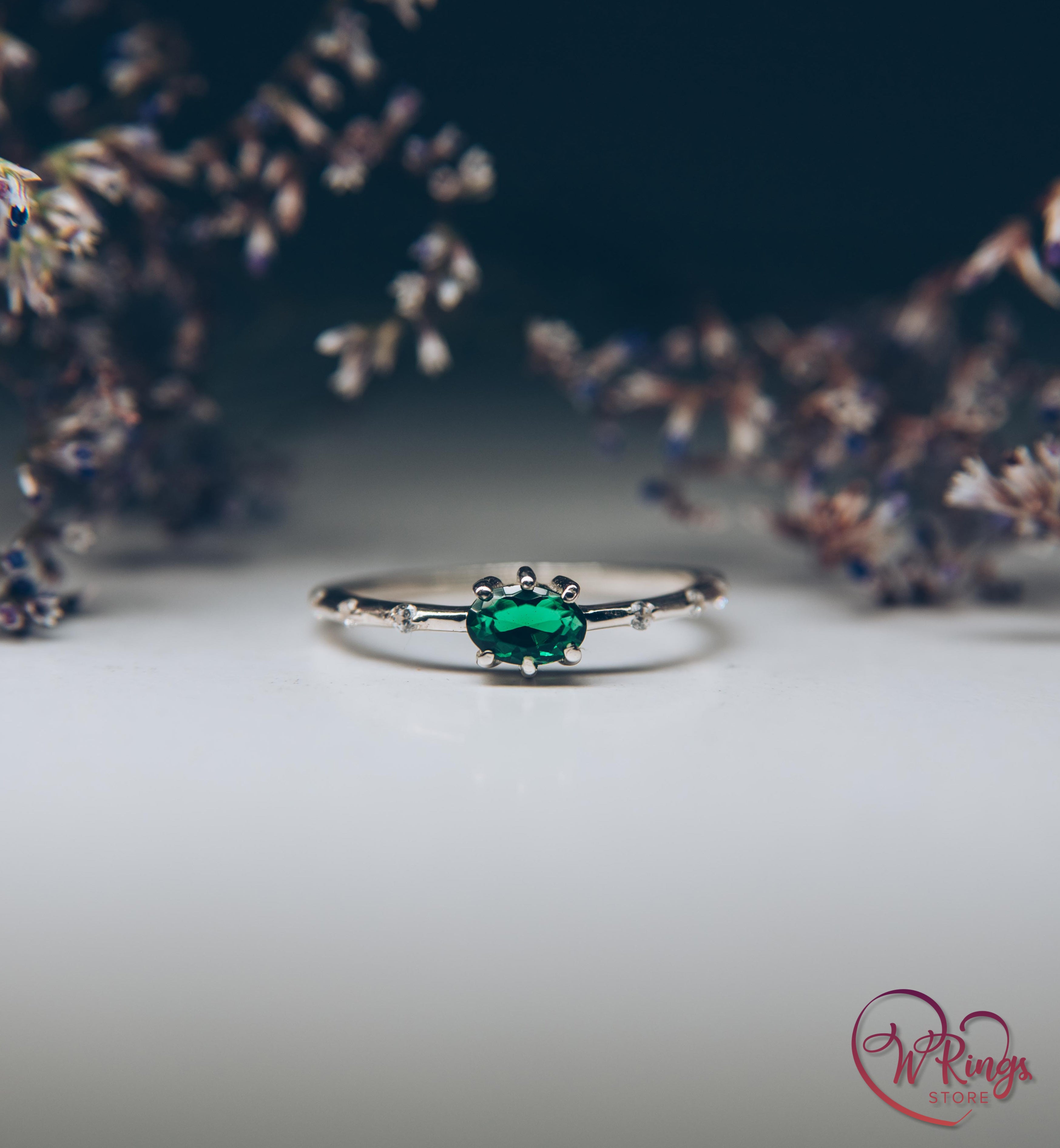 Oval cut Emerald Engagement Ring in Silver with Side Accents