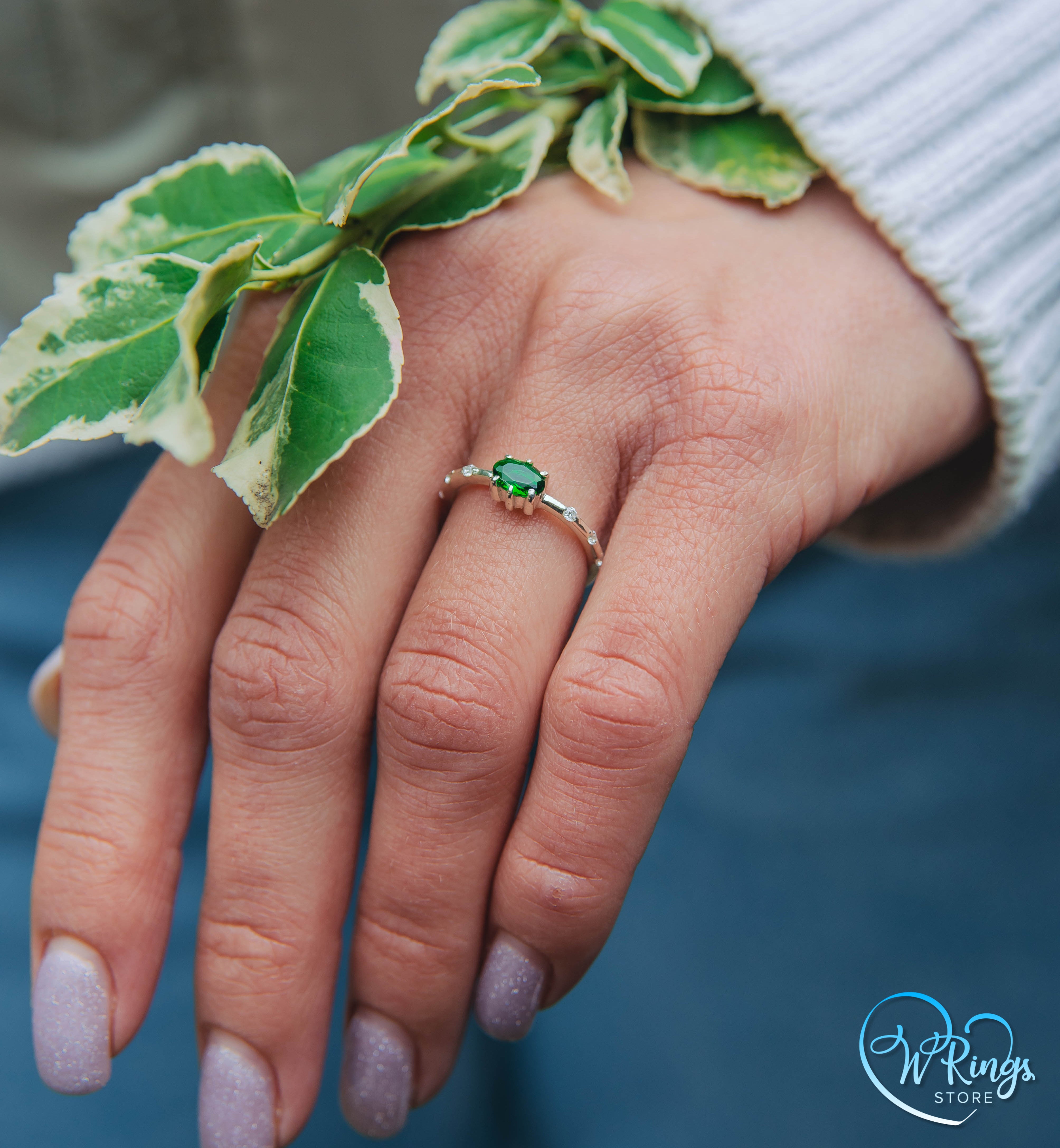 Oval cut Emerald Engagement Ring in Silver with Side Accents