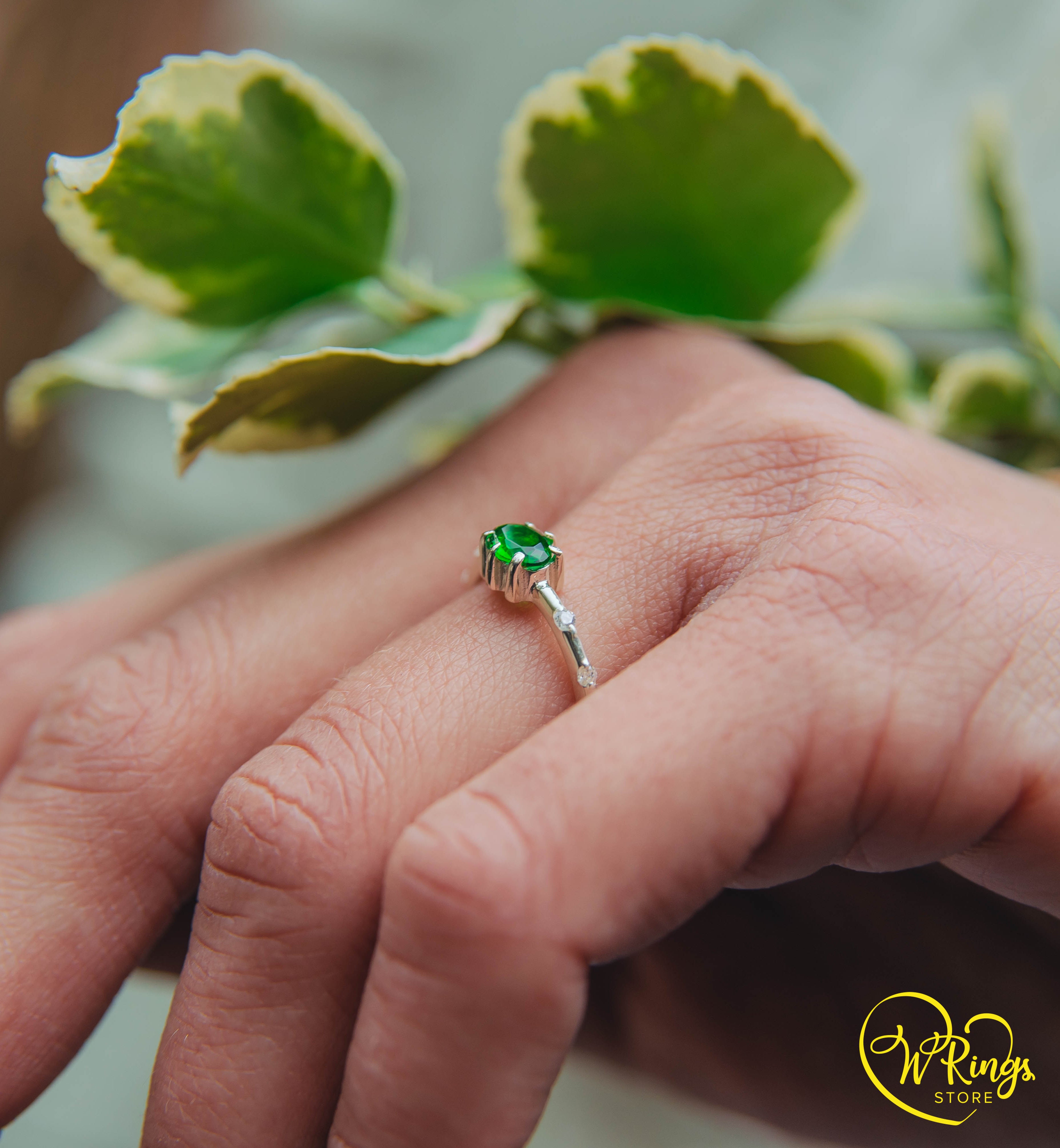 Oval cut Emerald Engagement Ring in Silver with Side Accents