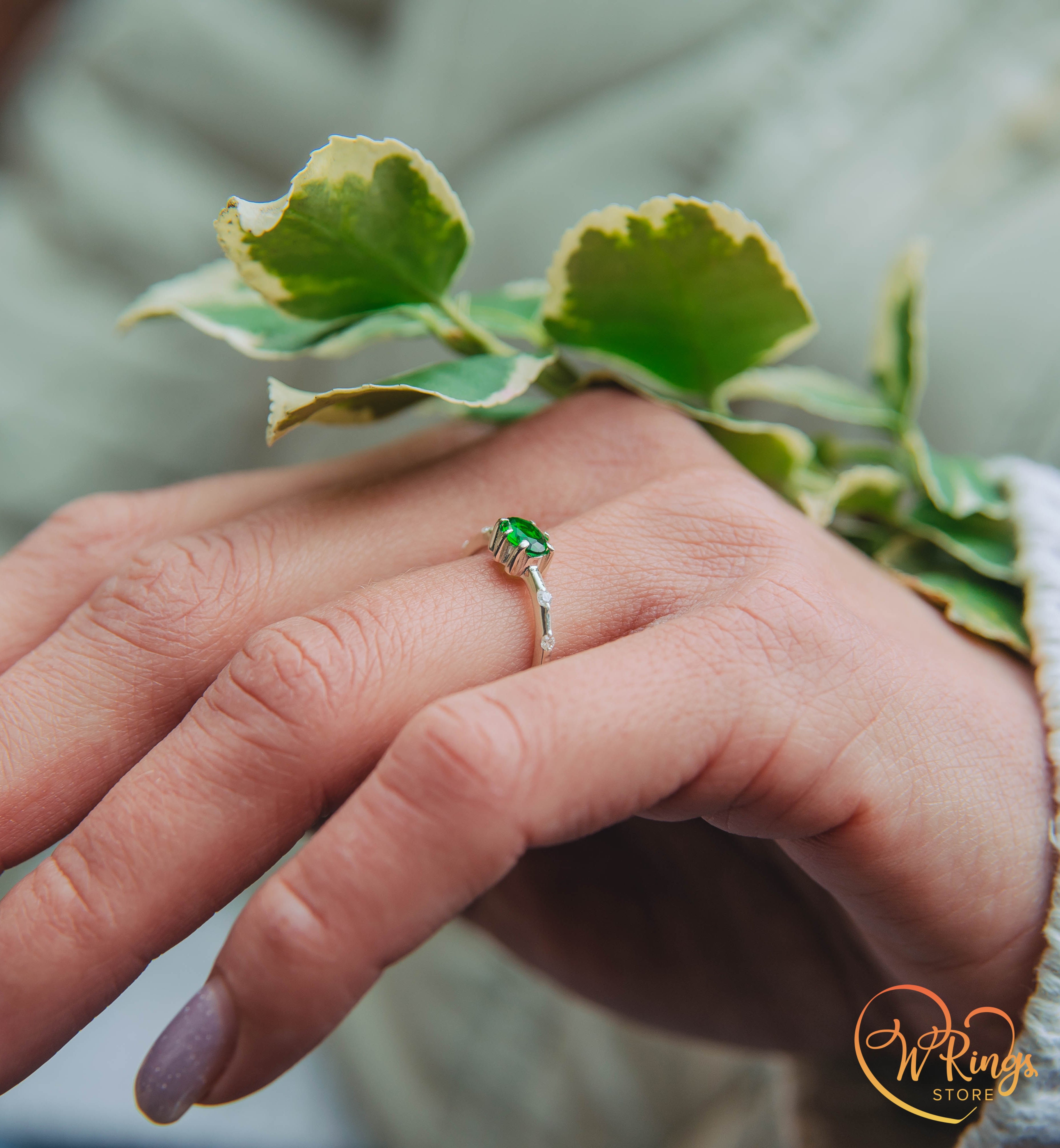 Oval cut Emerald Engagement Ring in Silver with Side Accents