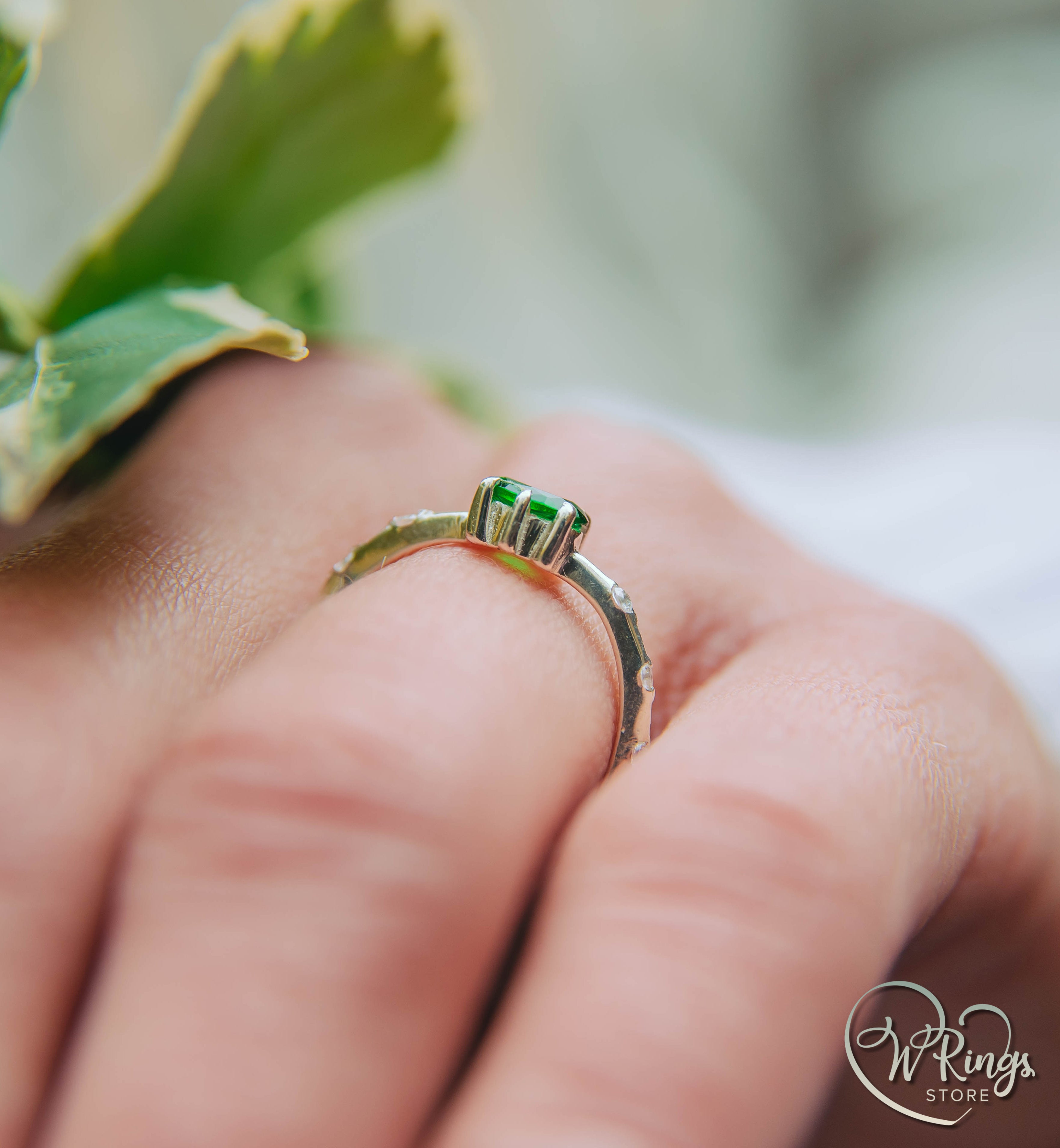 Oval cut Emerald Engagement Ring in Silver with Side Accents