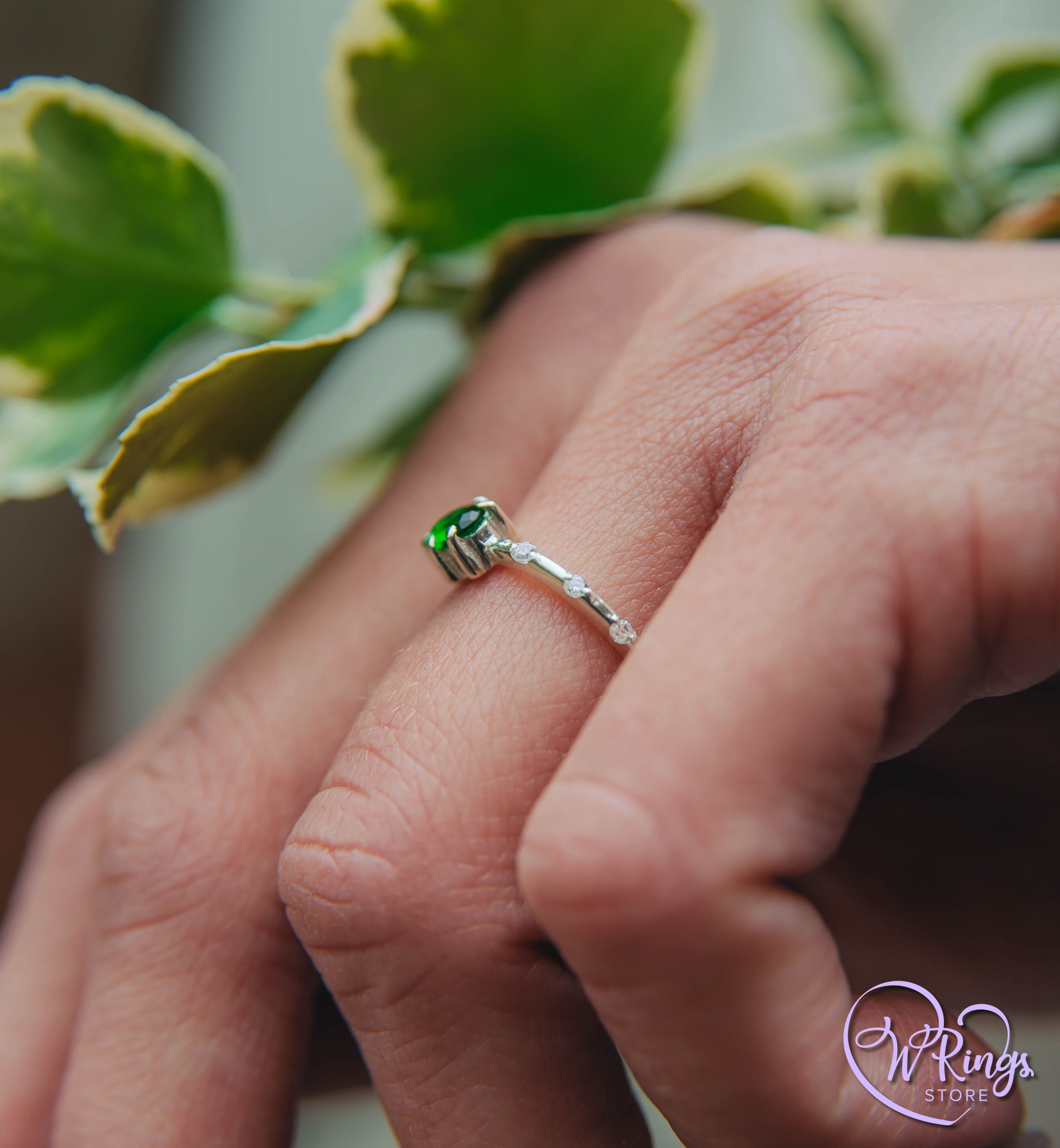 Oval cut Emerald Engagement Ring in Silver with Side Accents