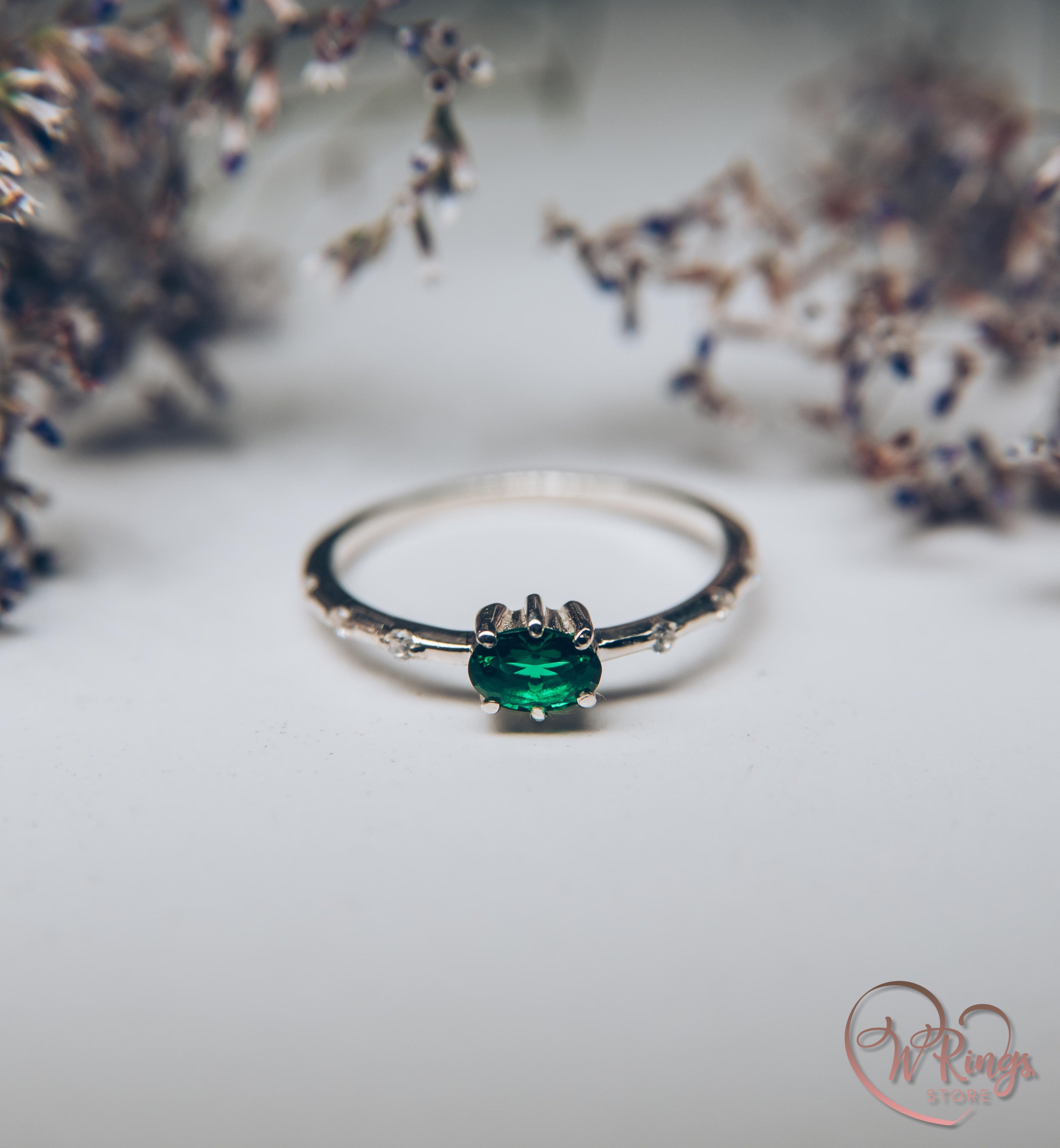 Oval cut Emerald Engagement Ring in Silver with Side Accents