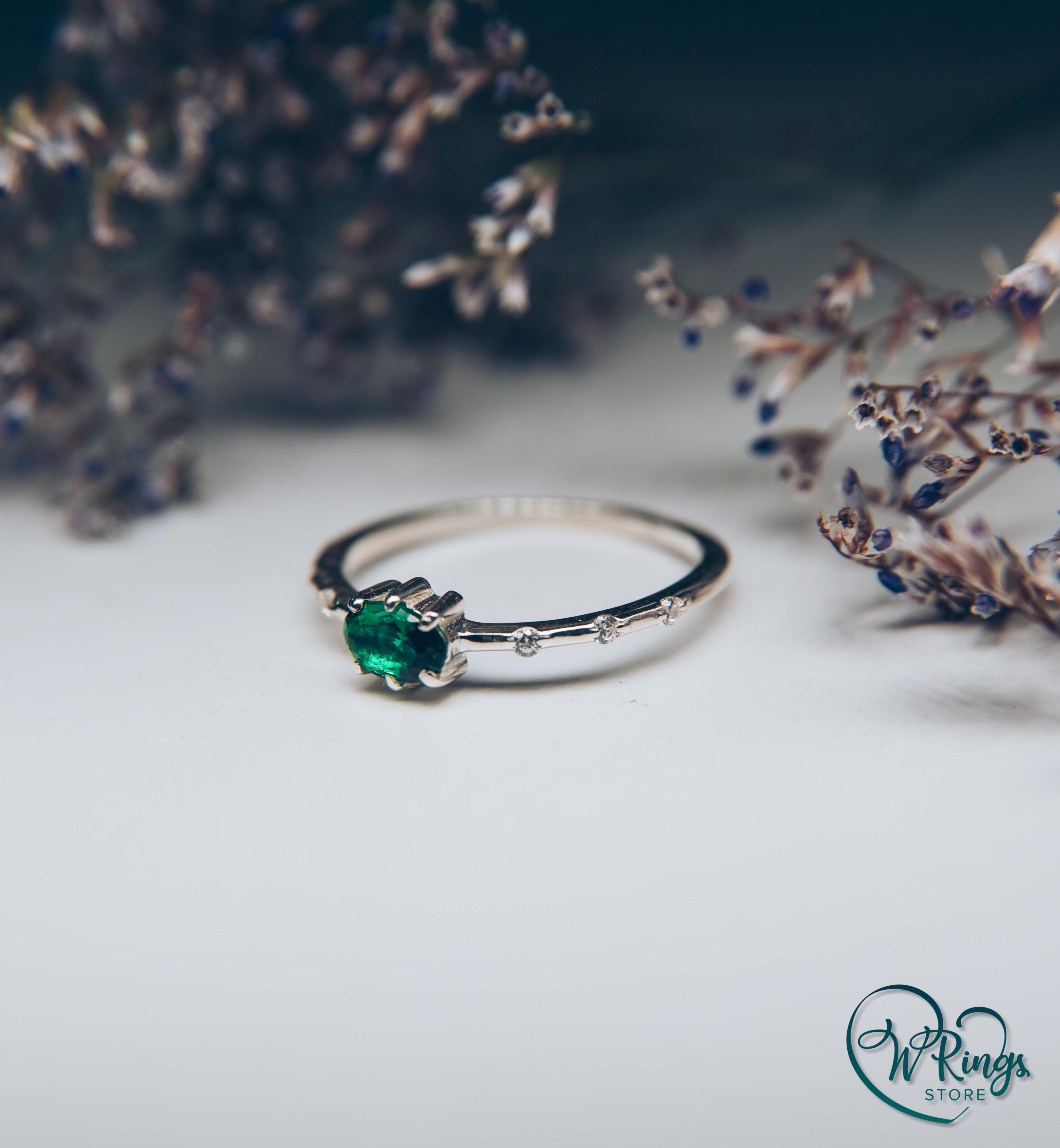 Oval cut Emerald Engagement Ring in Silver with Side Accents