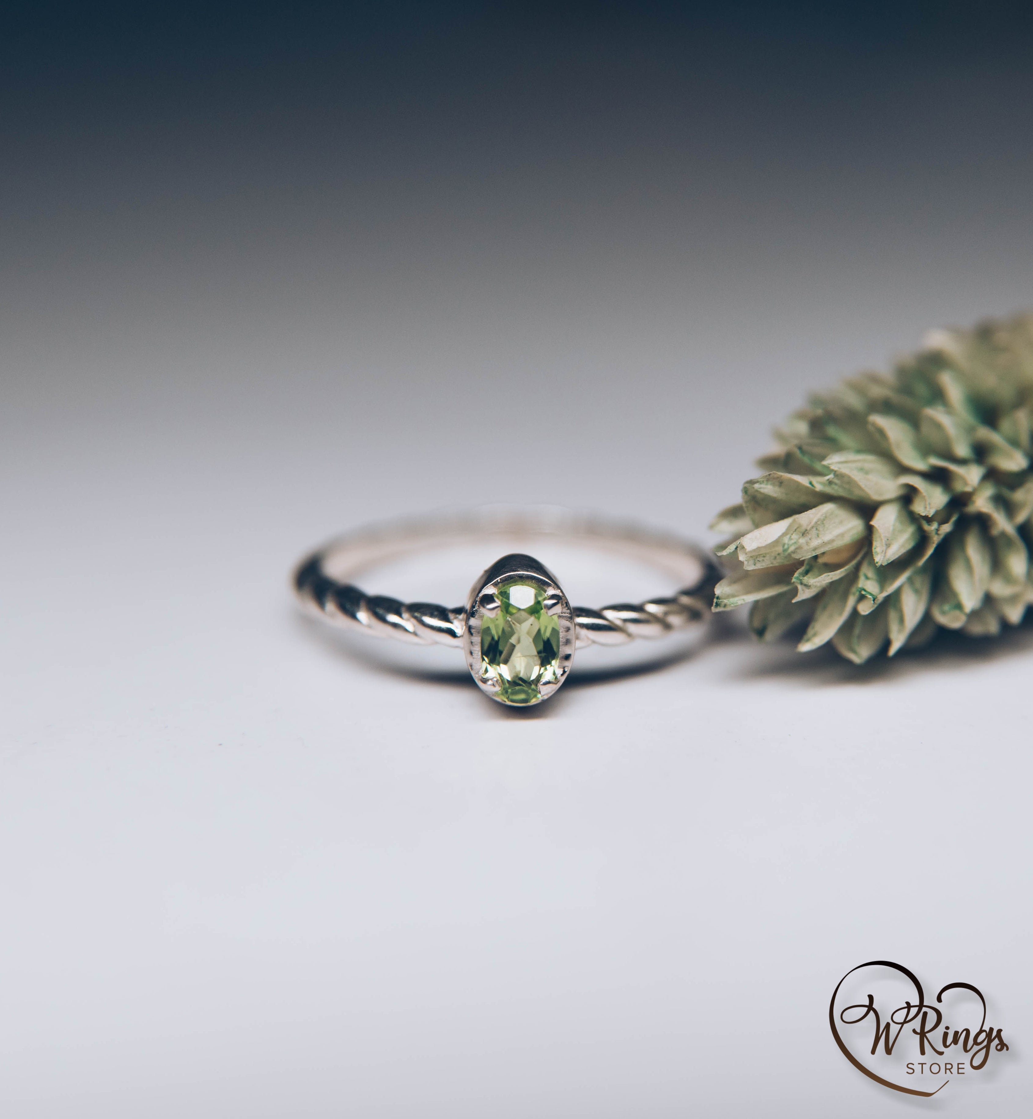 Oval shape Peridot Silver Solitaire Ring with rope style shank