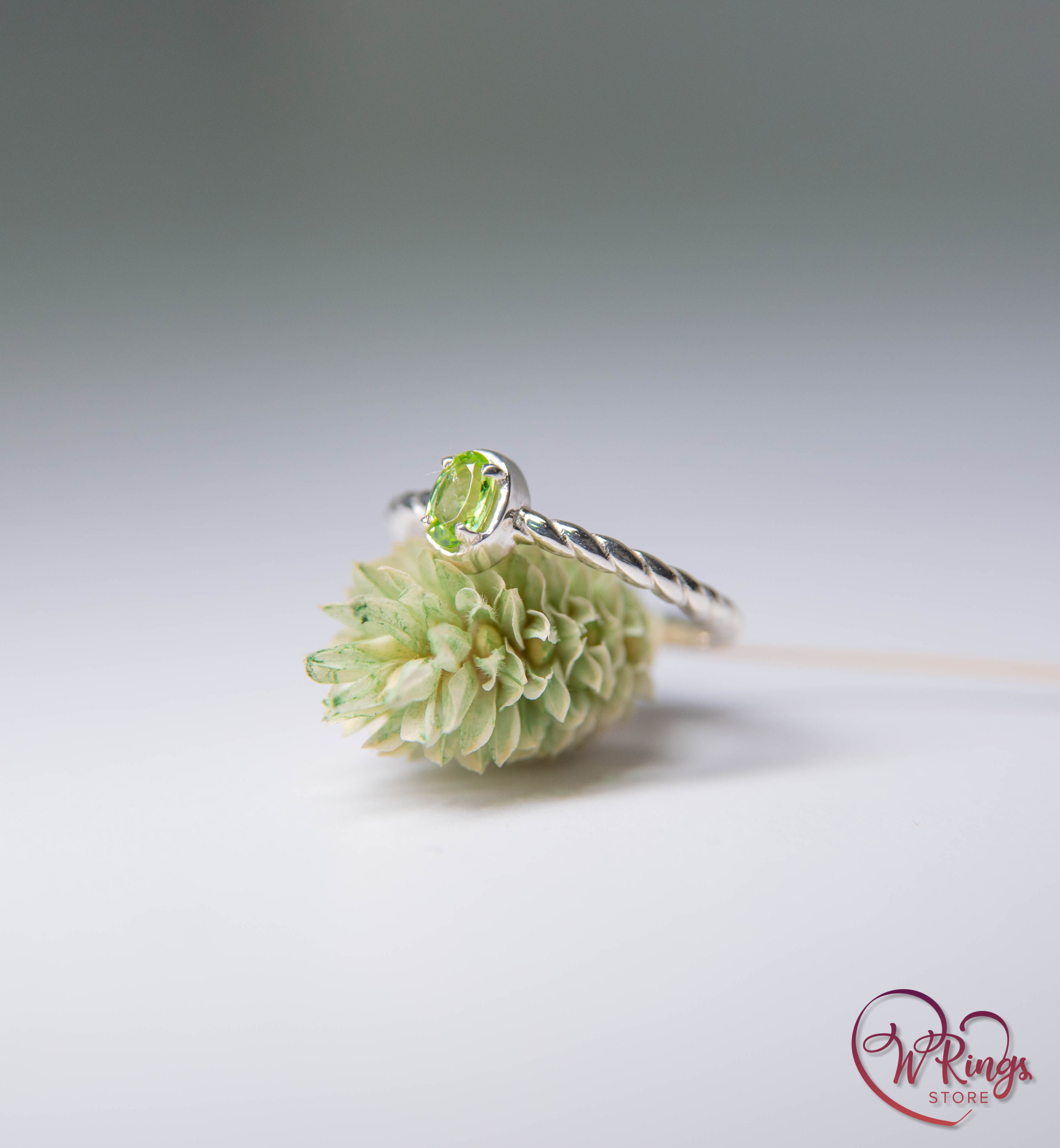 Oval shape Peridot Silver Solitaire Ring with rope style shank