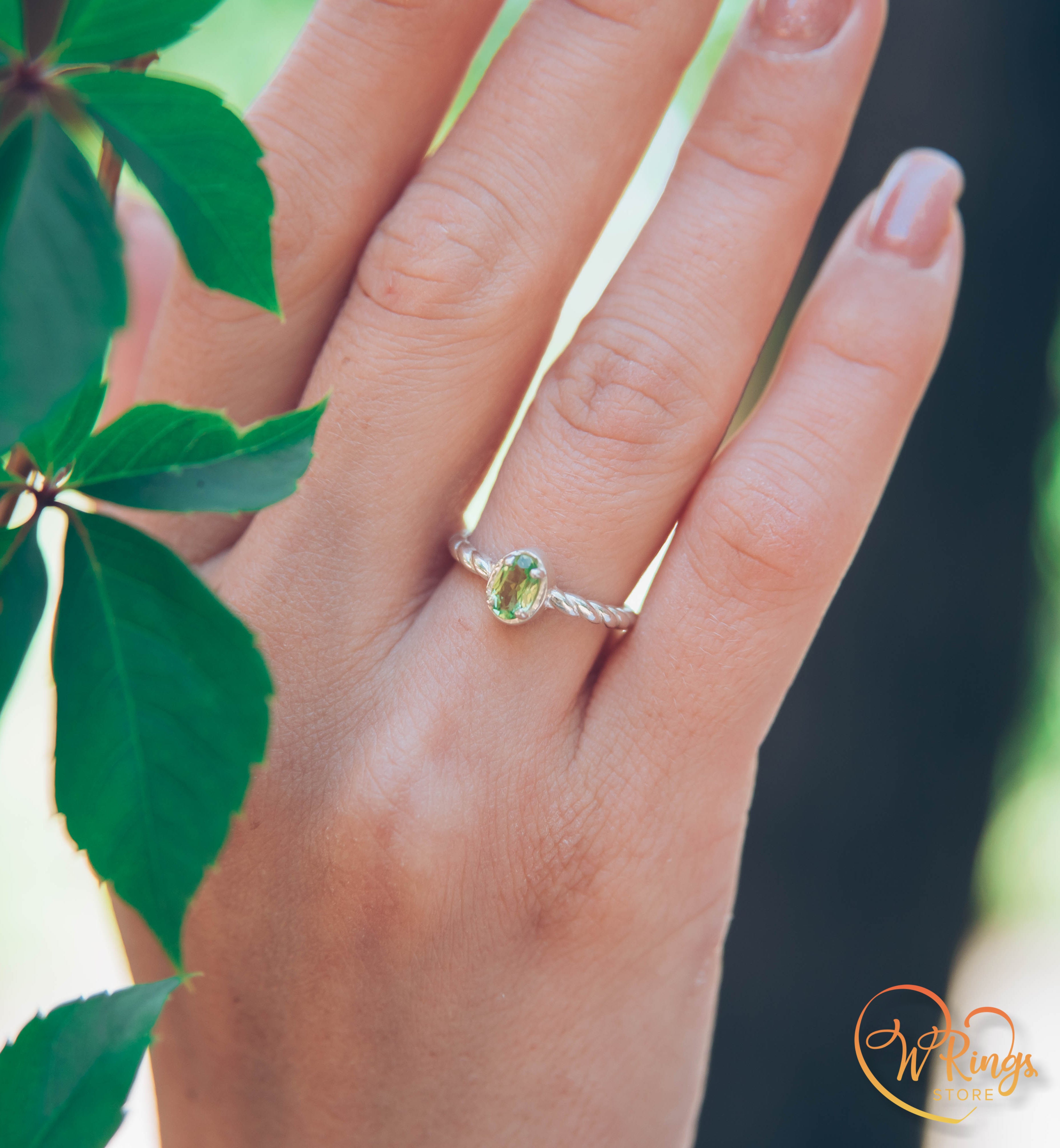 Oval shape Peridot Silver Solitaire Ring with rope style shank