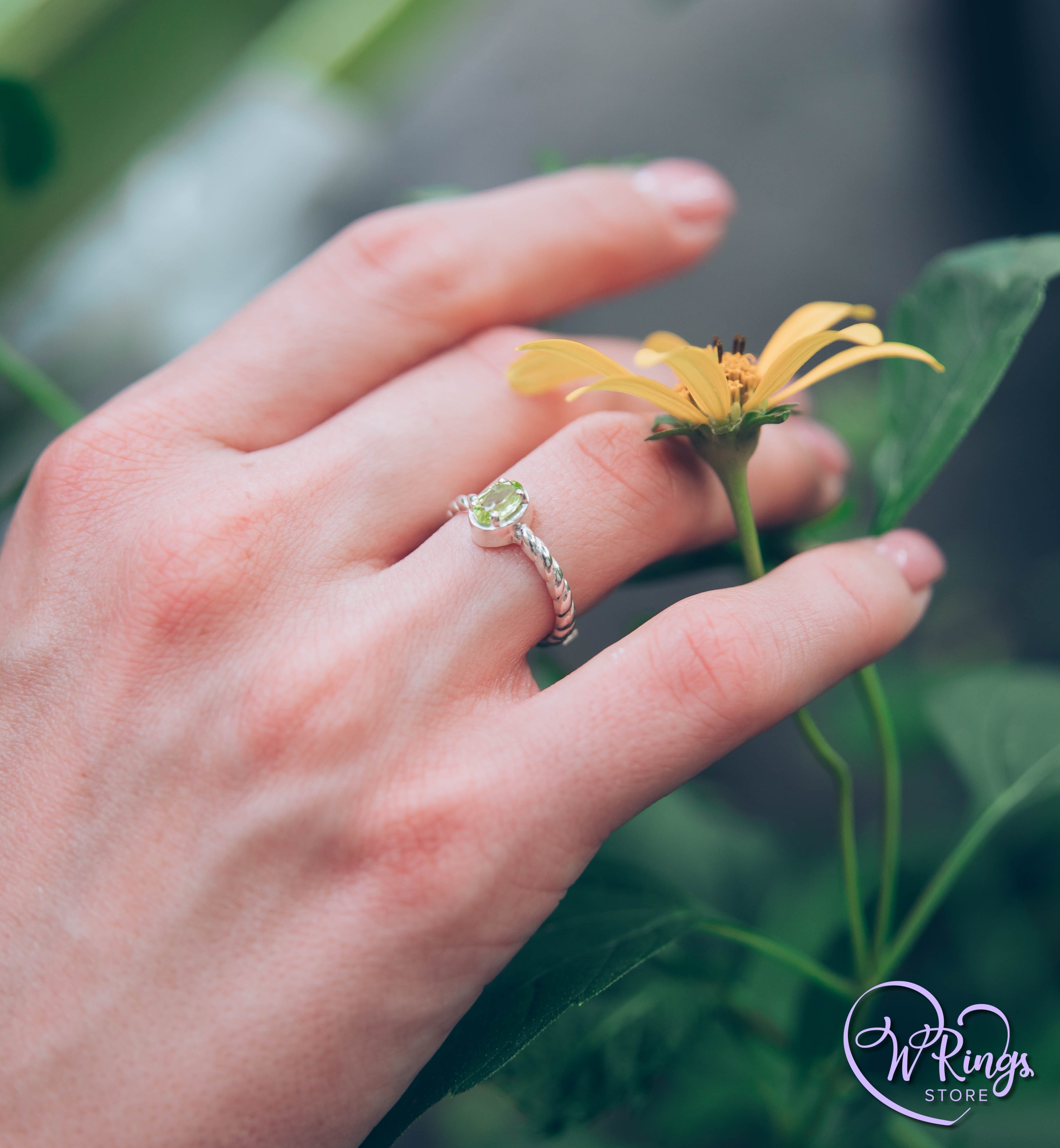 Oval shape Peridot Silver Solitaire Ring with rope style shank