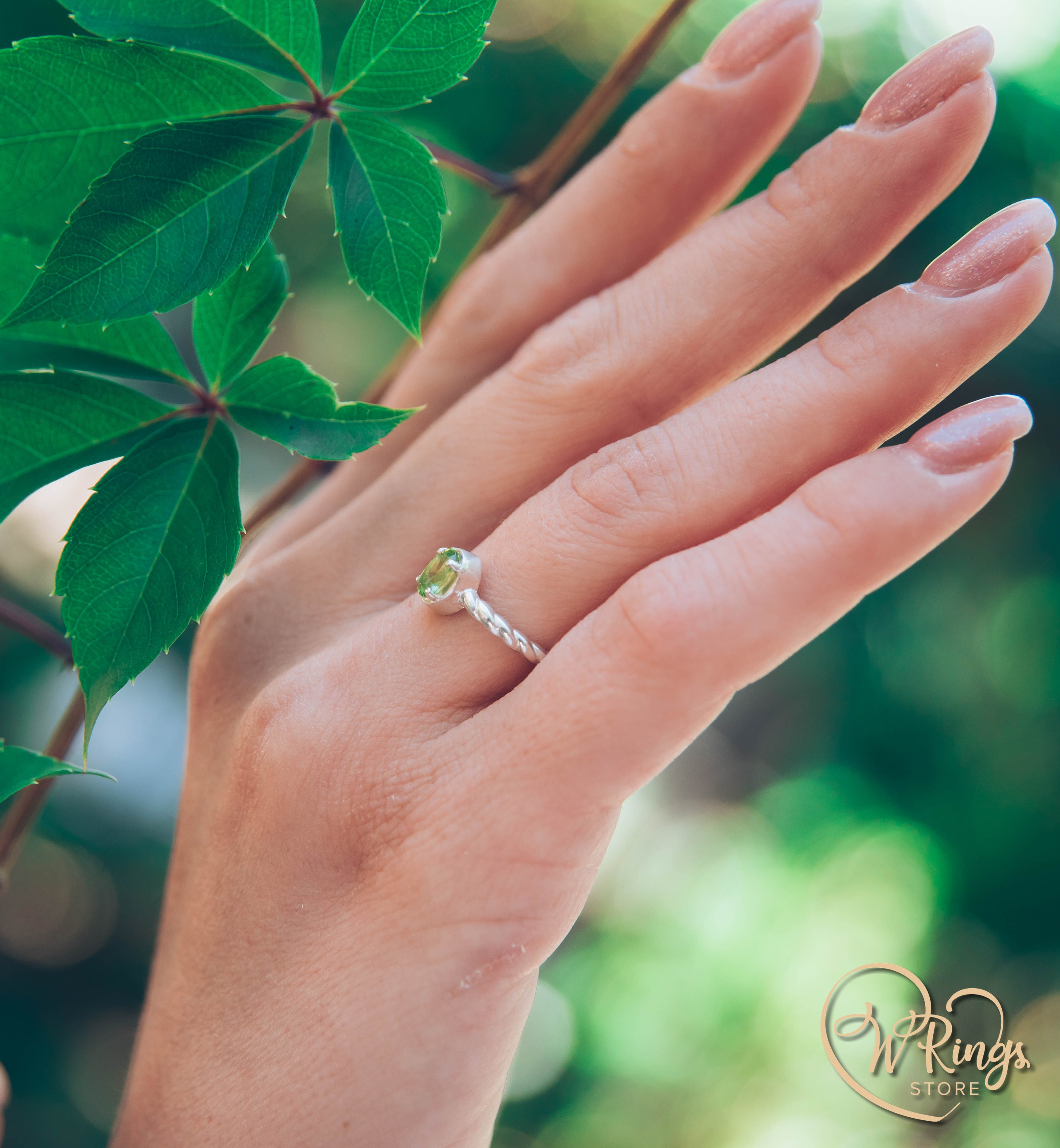 Oval shape Peridot Silver Solitaire Ring with rope style shank