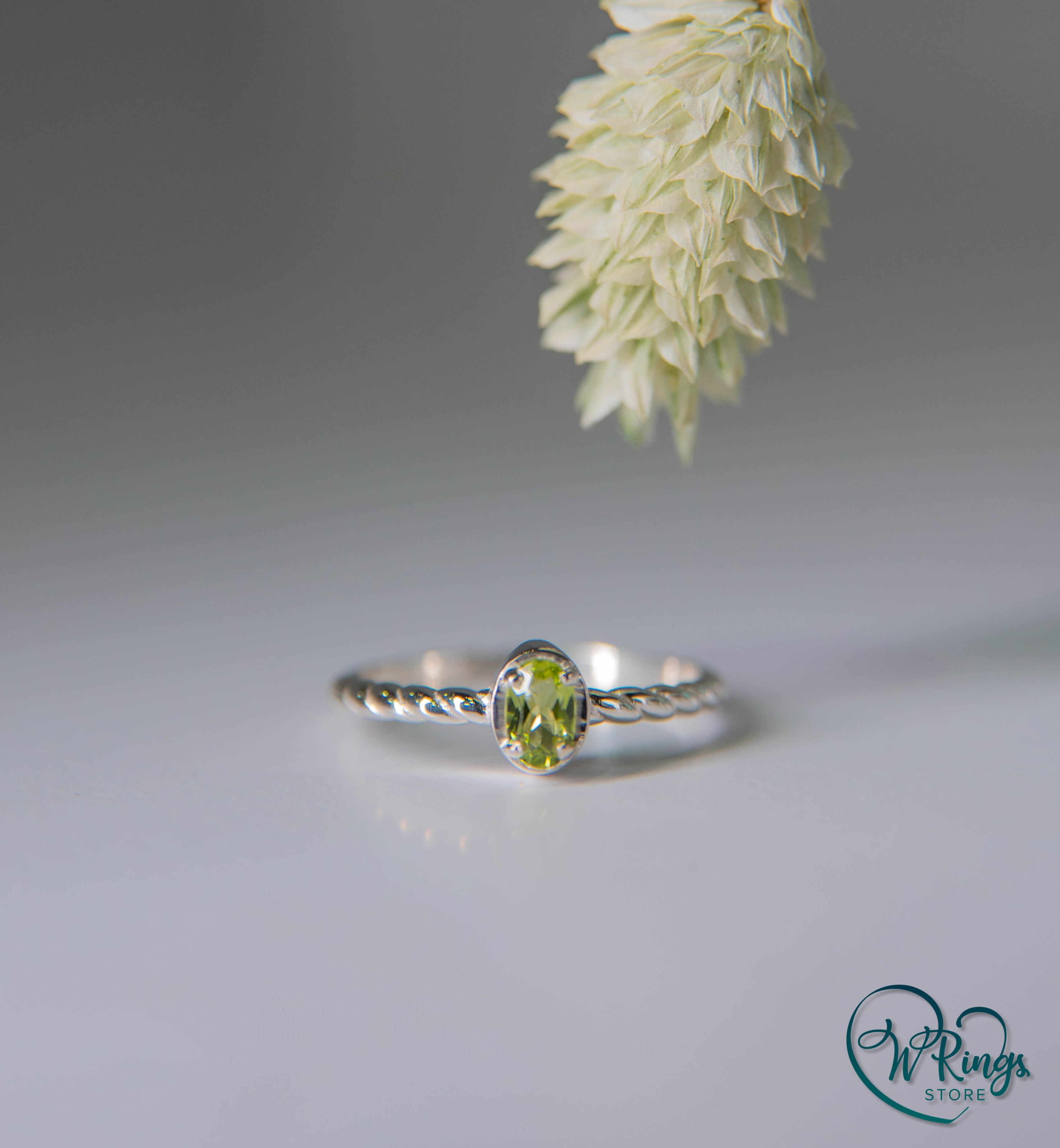 Oval shape Peridot Silver Solitaire Ring with rope style shank