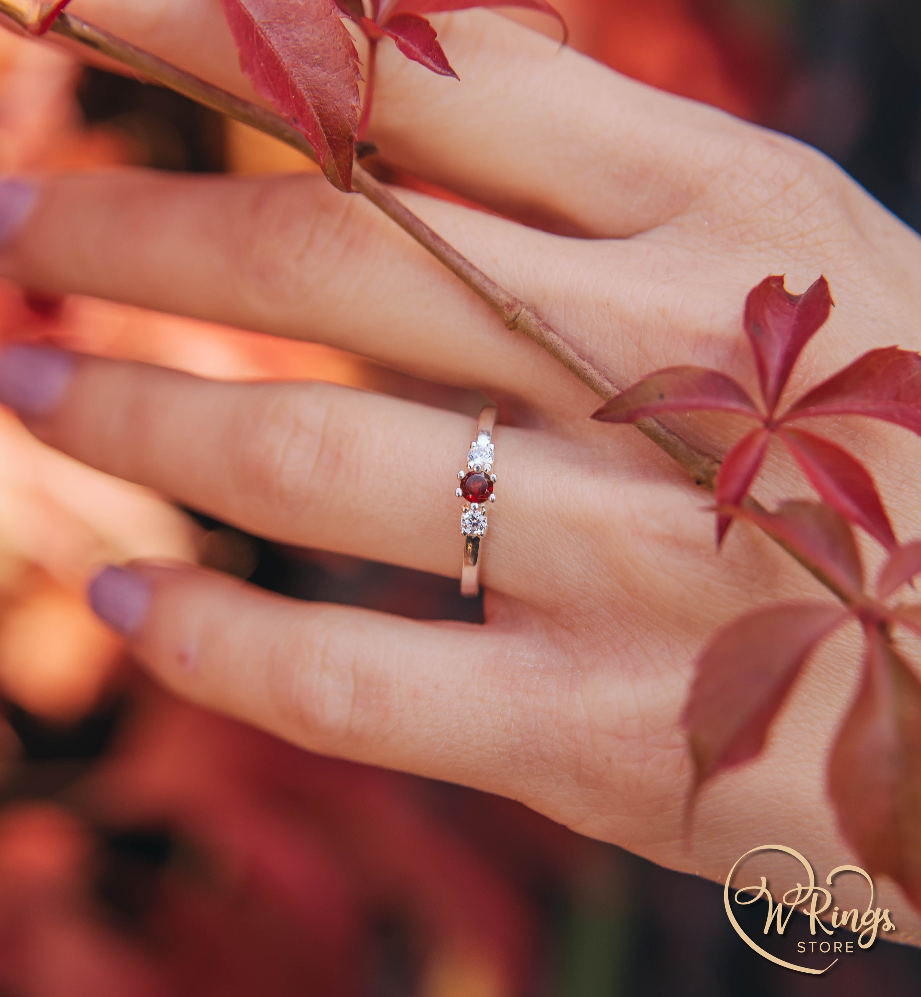 Round Garnet Three Stone Engagement Ring in Silver