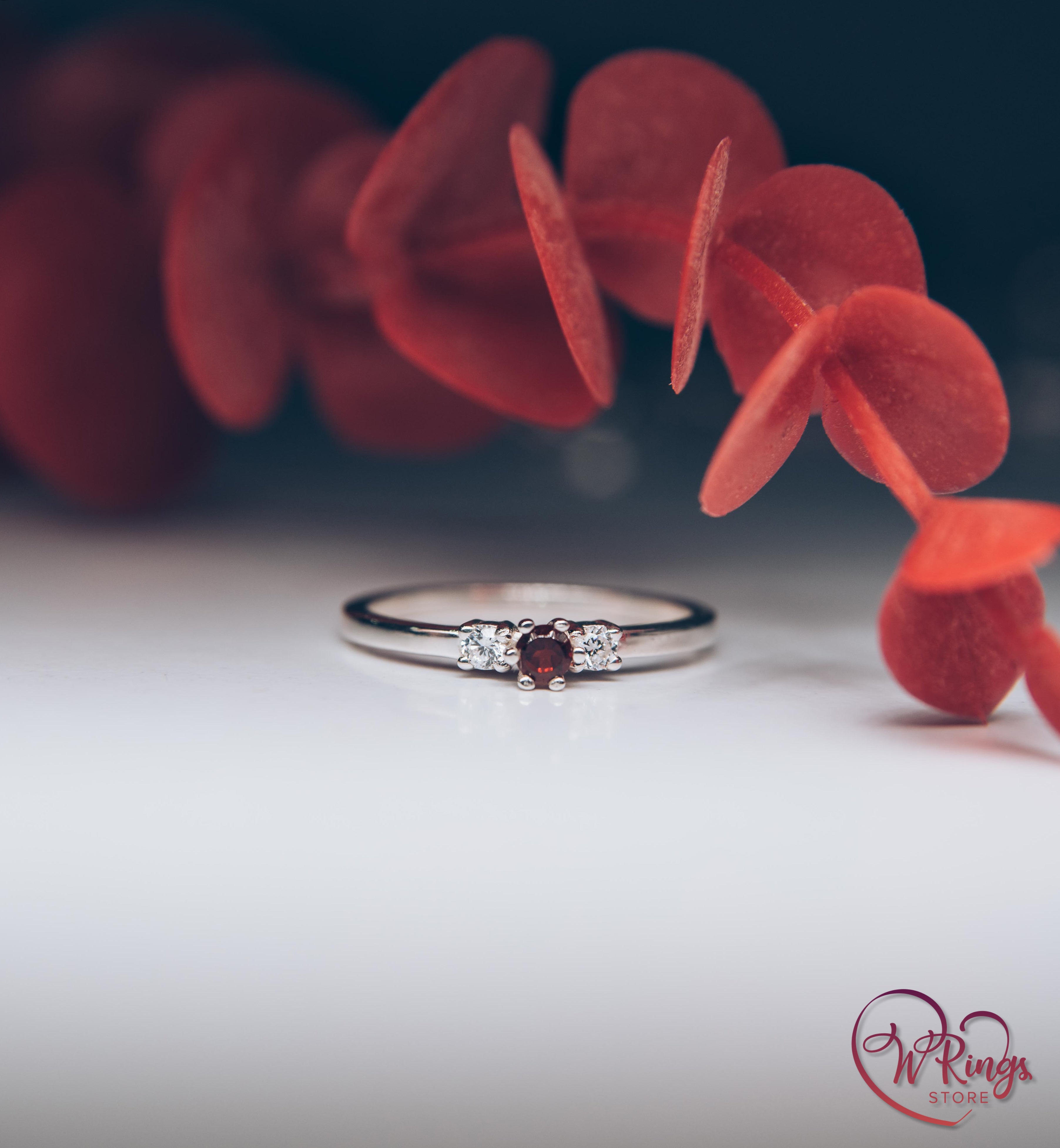 Round Garnet Three Stone Engagement Ring in Silver