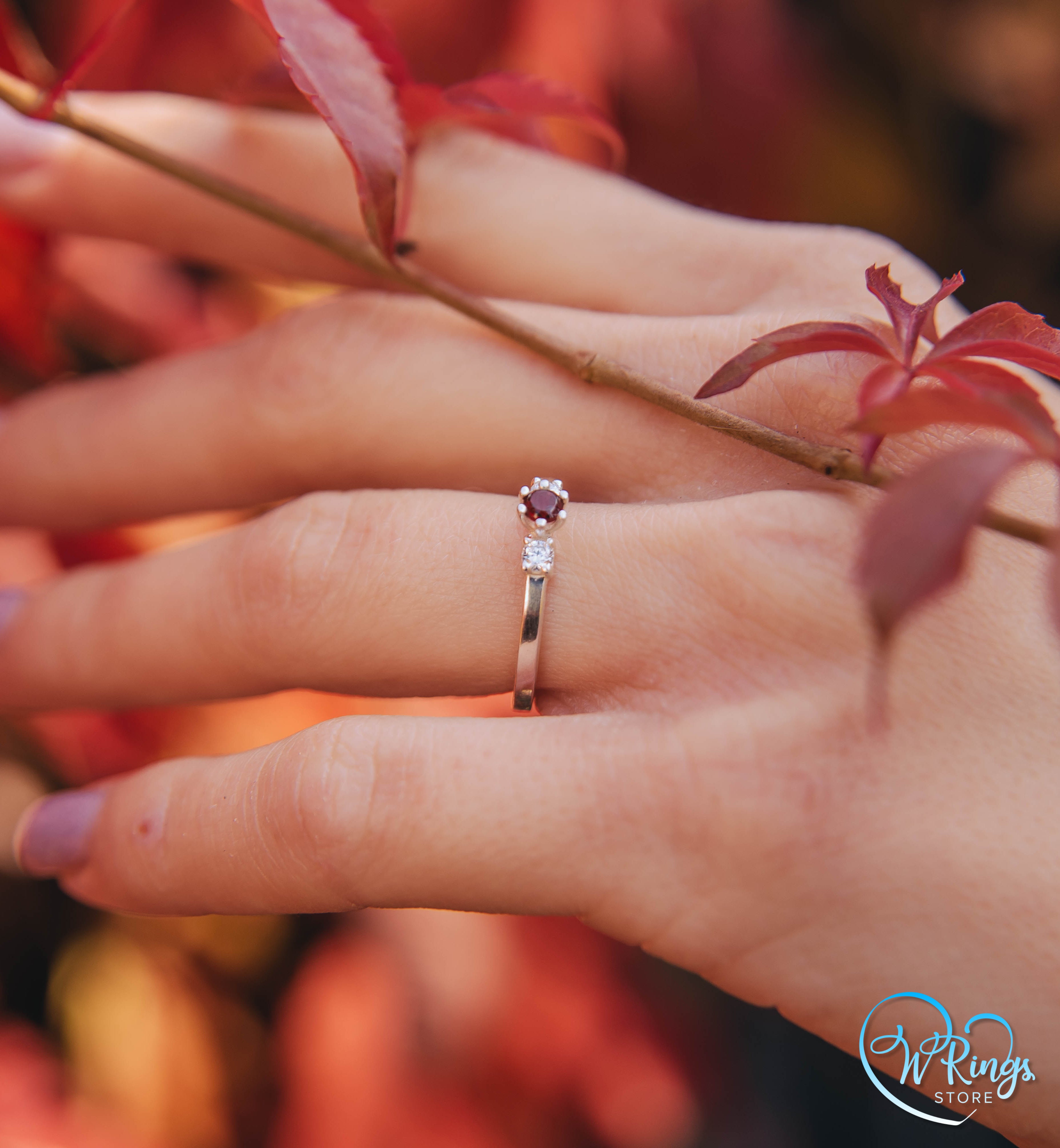 Round Garnet Three Stone Engagement Ring in Silver