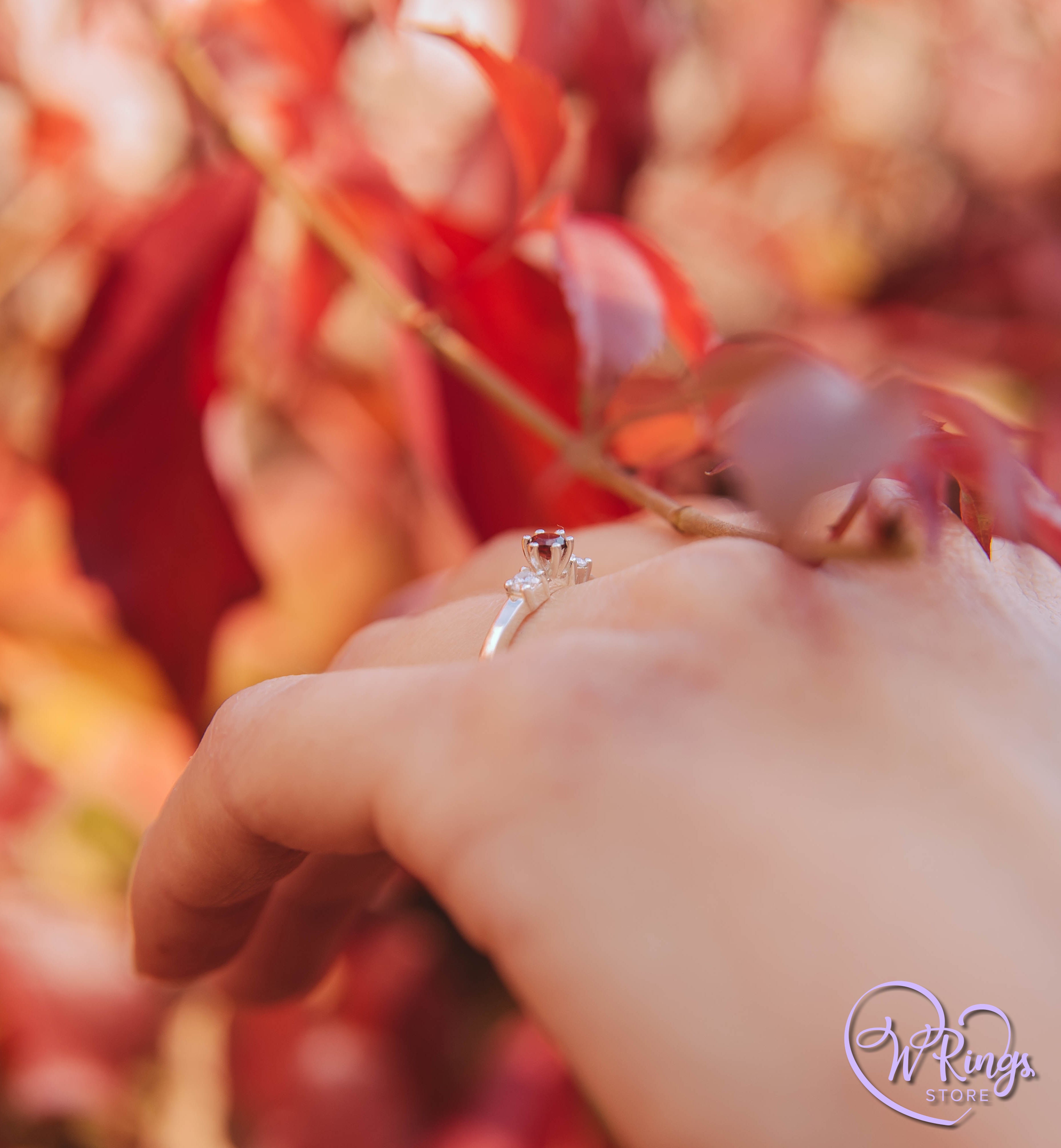 Round Garnet Three Stone Engagement Ring in Silver