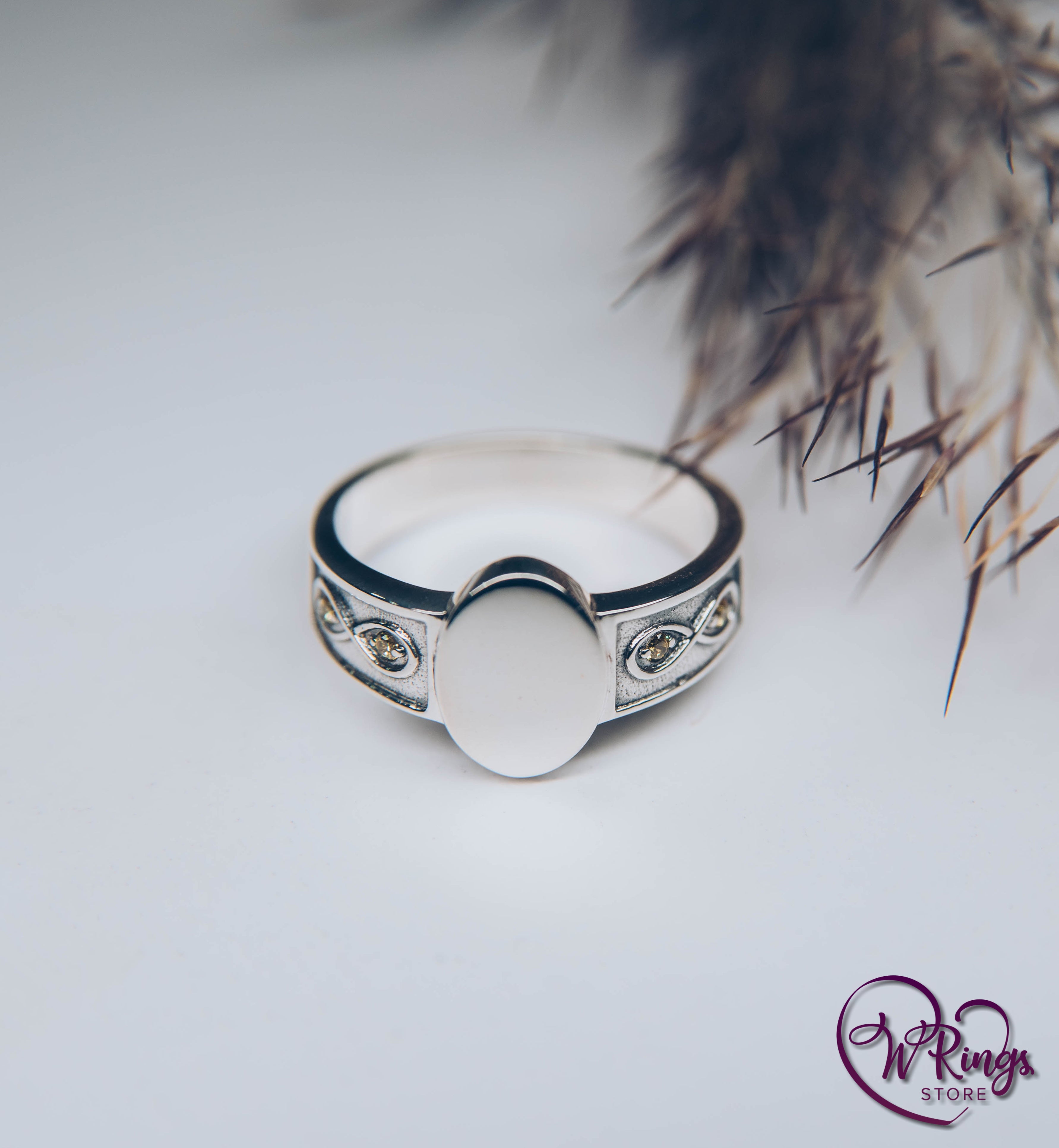 Side Infinity symbol on Silver Oval Signet Ring with small Gemstones