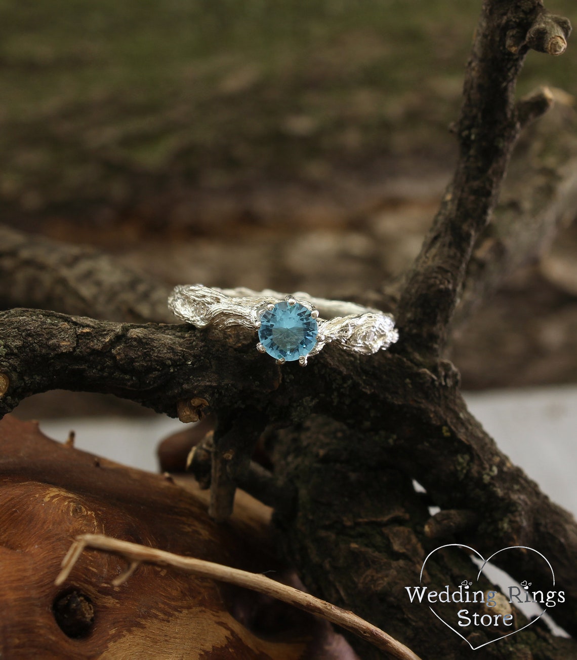 Vivid Topaz Engagement Ring with Silver Branch