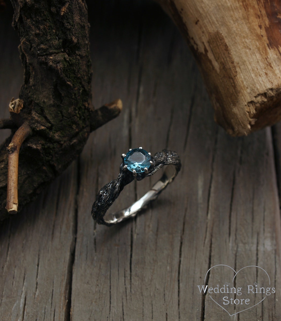 Vivid Topaz Engagement Ring with Silver Branch