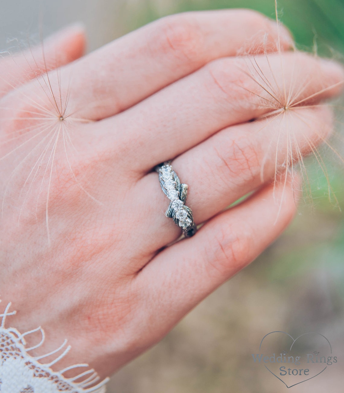 Intertwined Twig Silver Ring with Cubic Zirconia on the knots