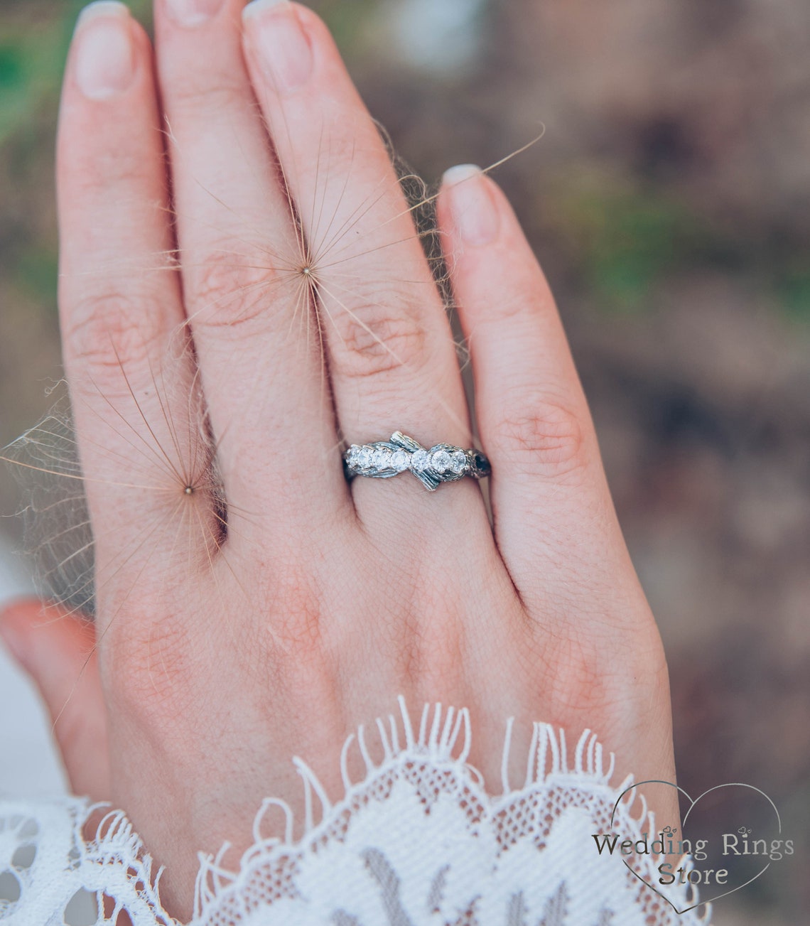 Intertwined Twig Silver Ring with Cubic Zirconia on the knots