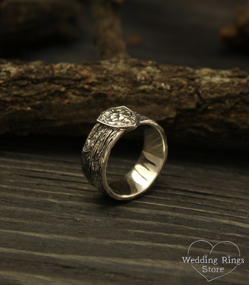 Unique Solid Silver Lion head Ring for Men placed in a Shield