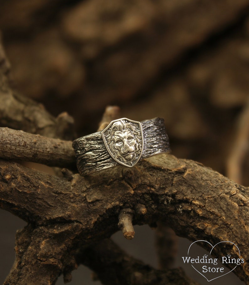 Unique Solid Silver Lion head Ring for Men placed in a Shield