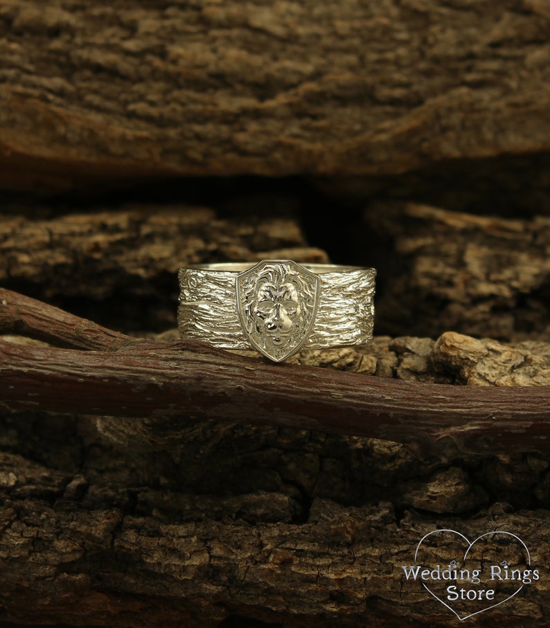 Unique Solid Silver Lion head Ring for Men placed in a Shield