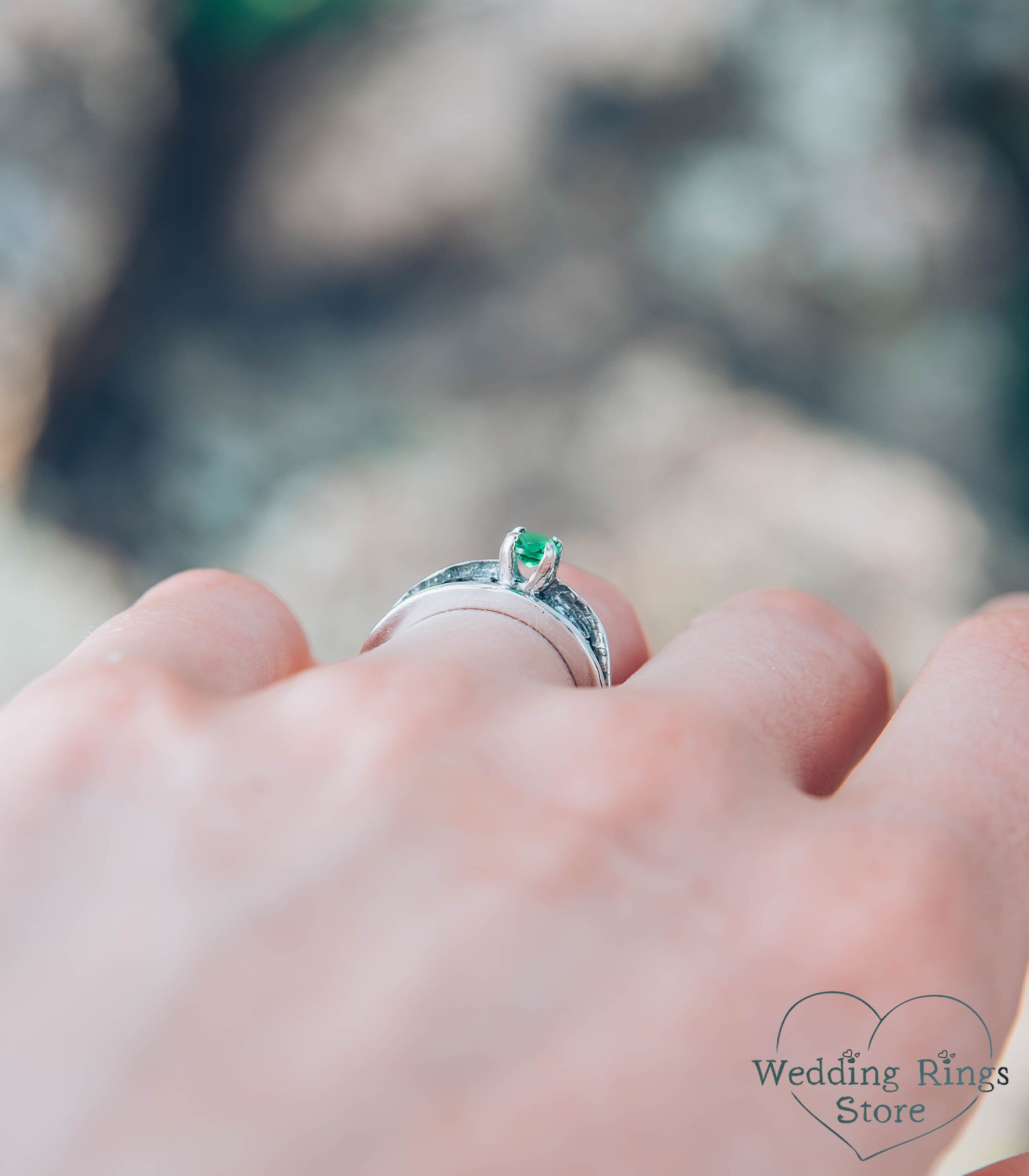 Avant garde Silver Hammered Engagement Ring with Emerald