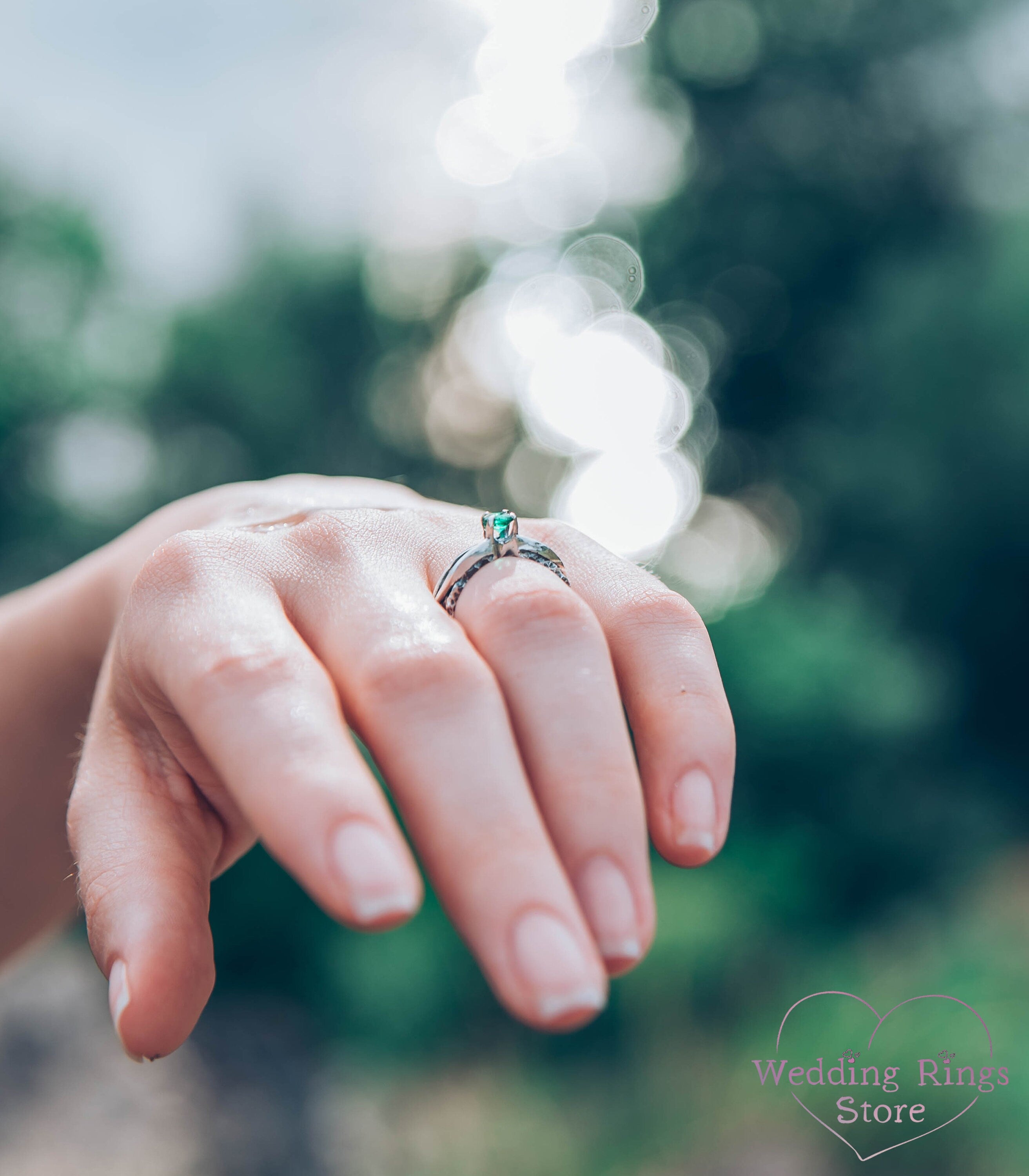 Avant garde Silver Hammered Engagement Ring with Emerald