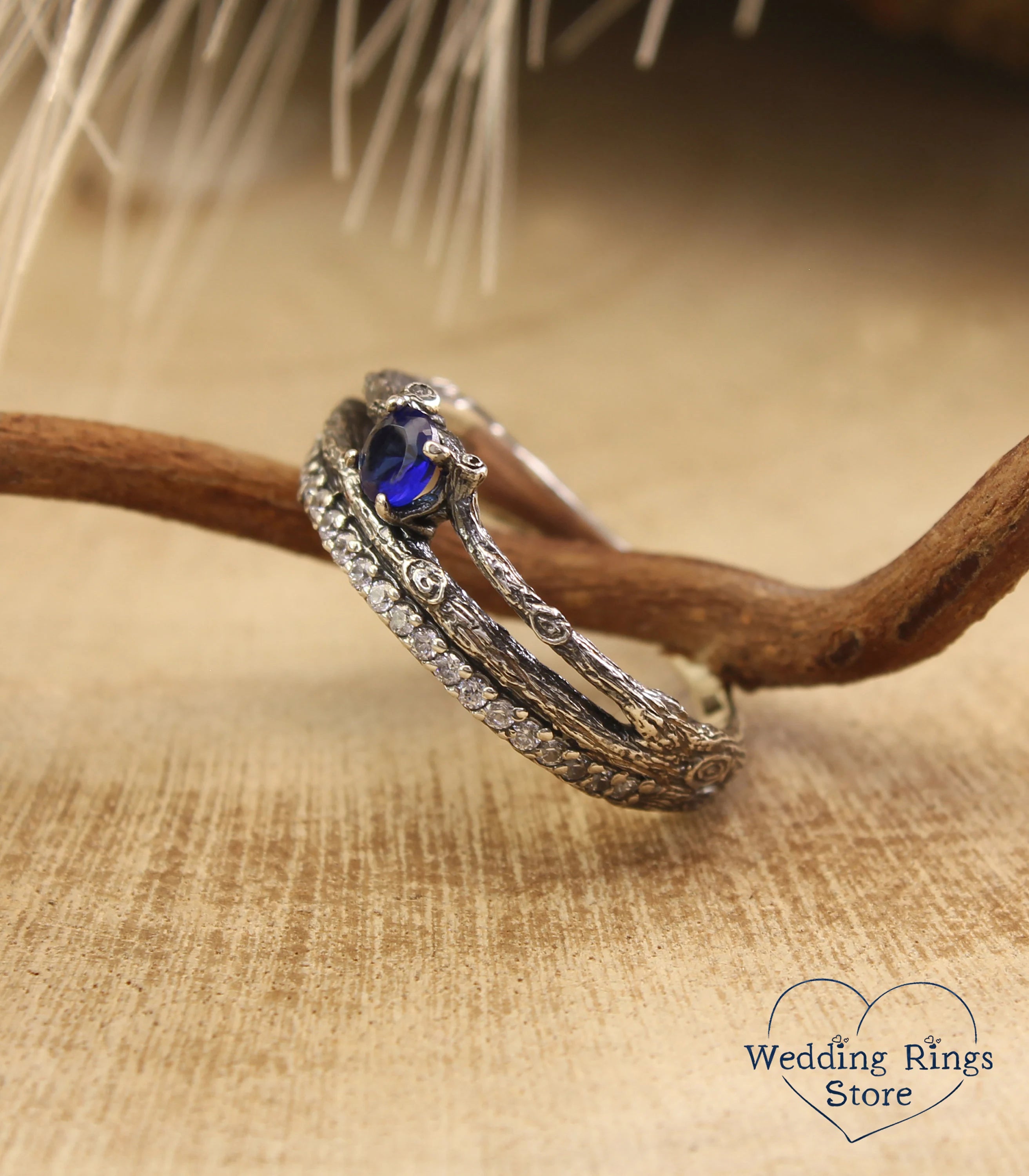 Split shank Silver Sapphire Engagement Ring with Side Stones on Twig